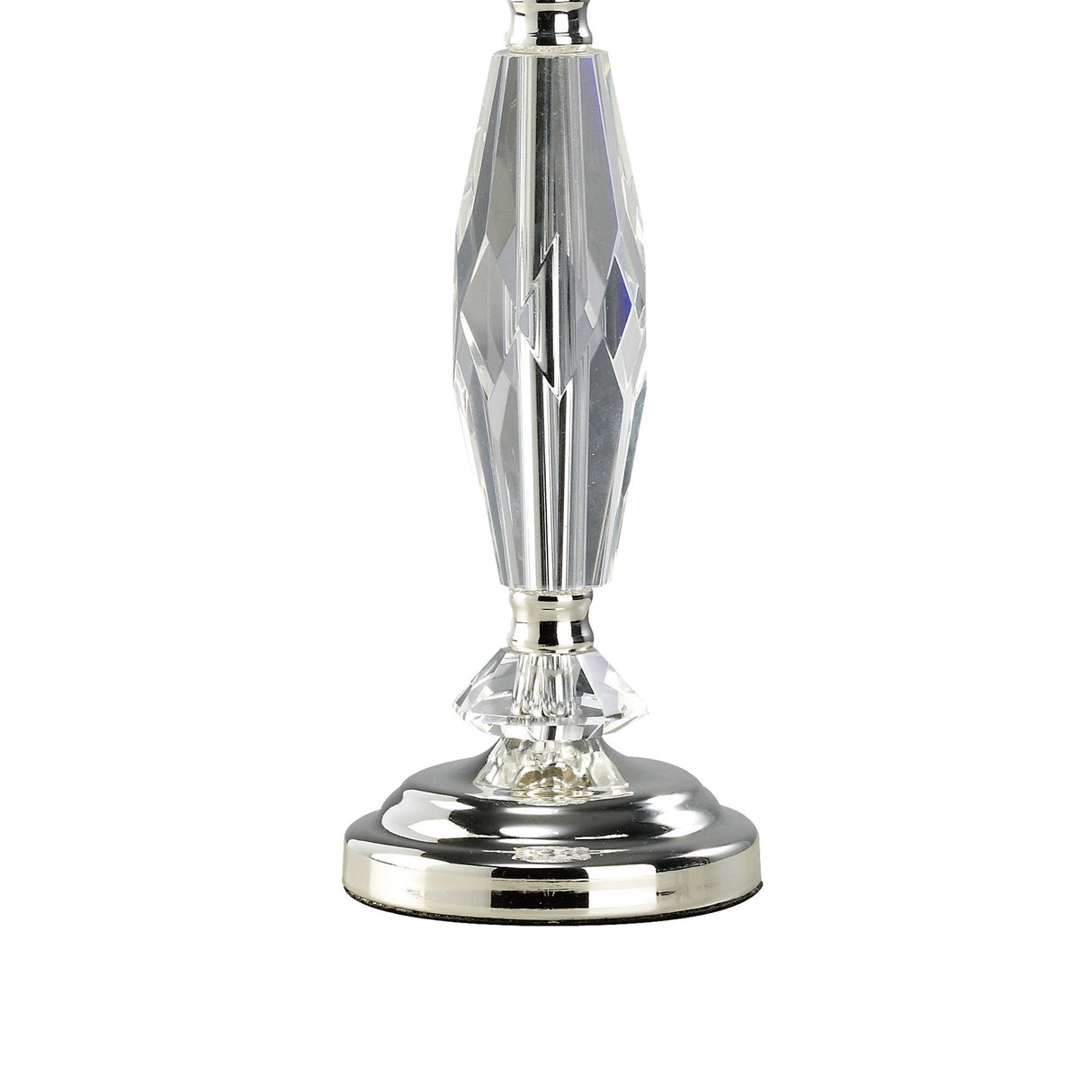 The image features the base of the Nexon 1 Light Crystal Table Lamp with a faceted, clear crystal stem and a shiny silver circular base.