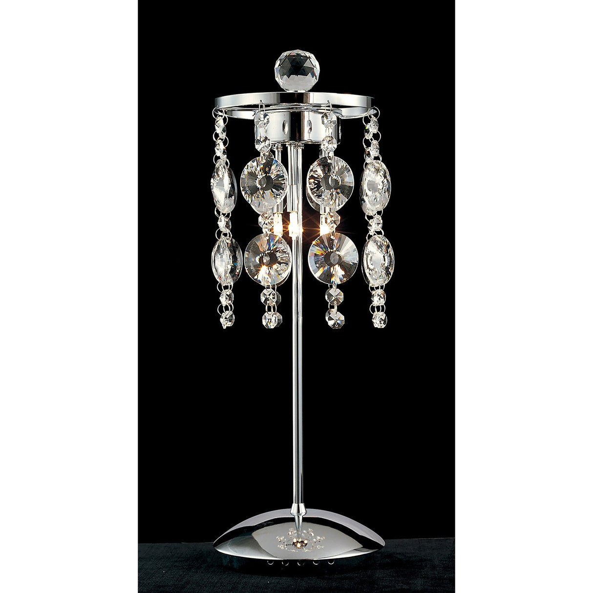 The Nico 3 Light Crystal Table Lamp in polished chrome features a modern design with hanging round and oval optical prism glass accents around the bulb, creating an elegant decorative effect against a black background.