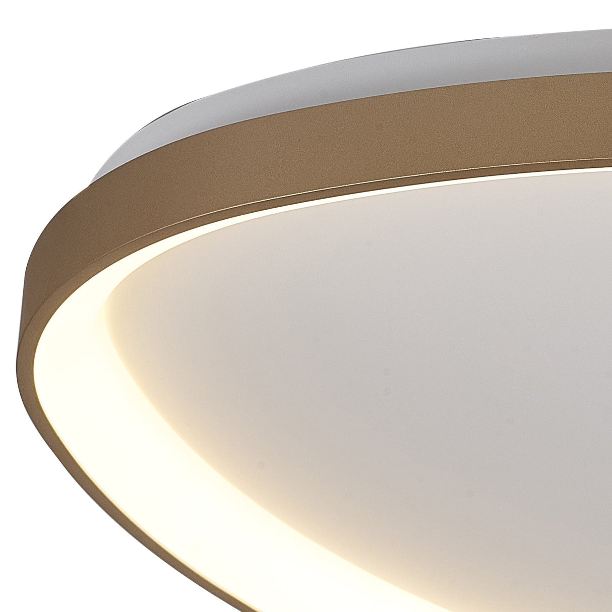Close-up of the Mantra Niseko flush ceiling light showing its curved gold metal frame and white diffuser with a warm backlit glow.