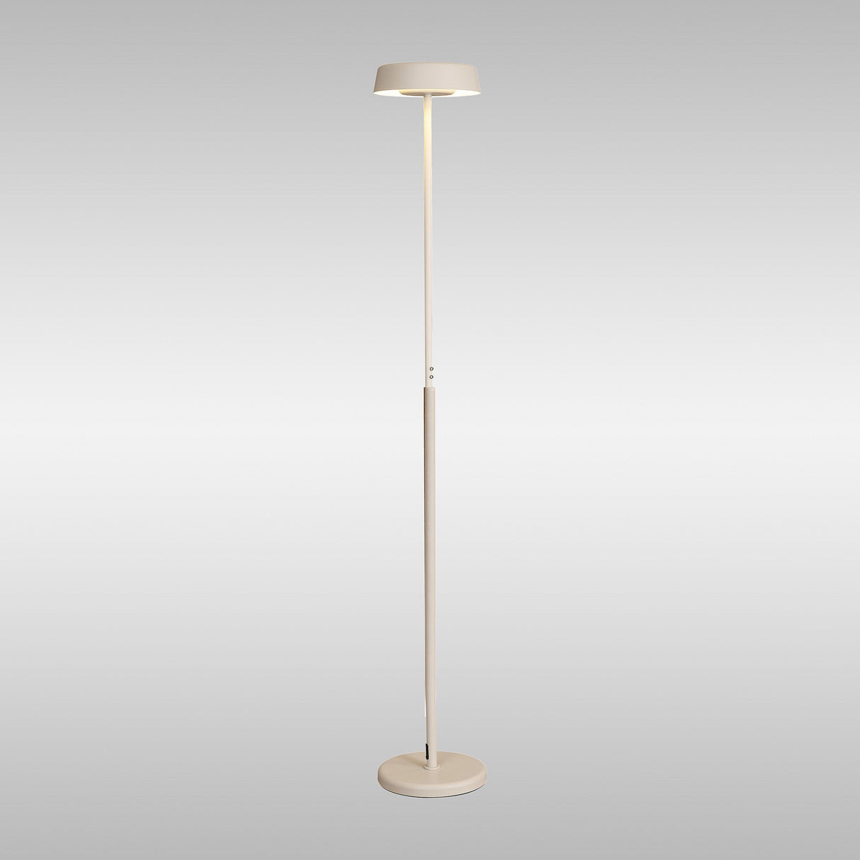 The Noa II Touch Dimmer LED Floor Lamp 15W 3000K in white features a slim, minimalist design with a round base and flat circular shade, offering soft adjustable light—all set against a plain, light grey background.