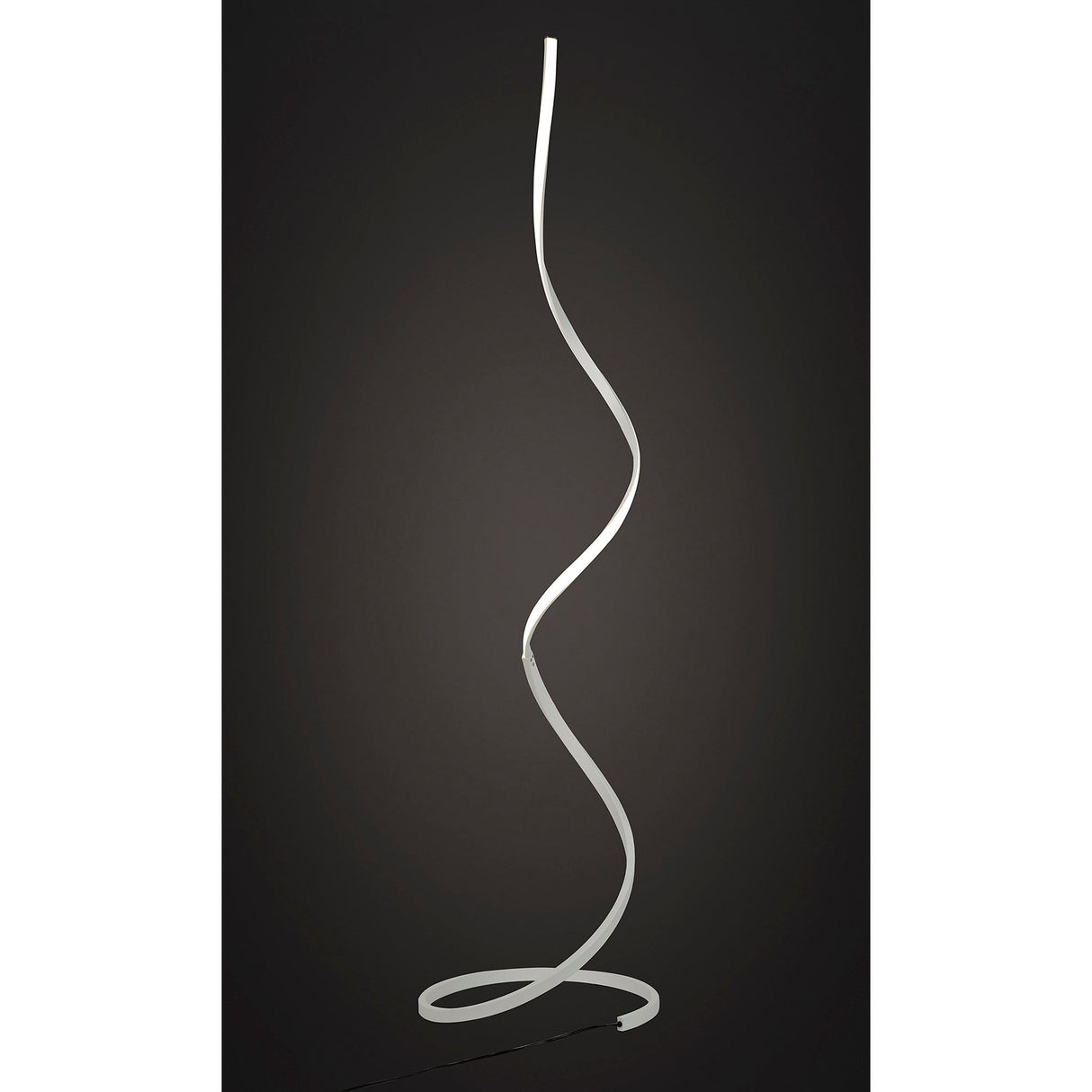 The Nur Blanco XL Dimmable LED Floor Lamp 20W 3000K in white features a slim, spiral-shaped design and emits soft, adjustable light along its curved metallic structure, making a modern statement against dark backgrounds.