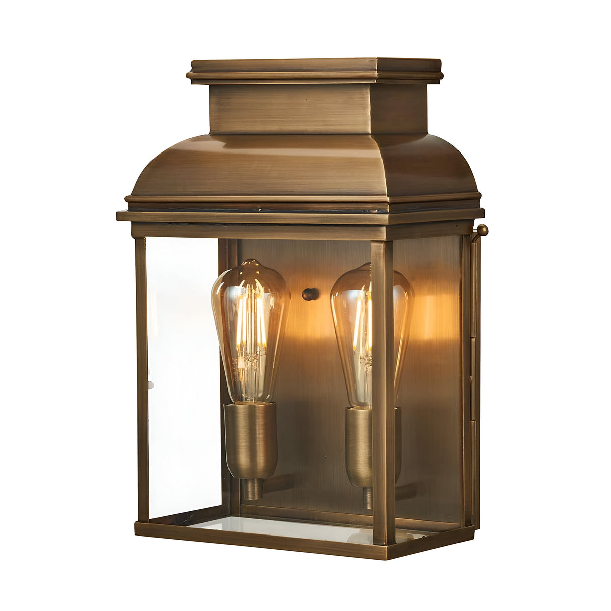 Introducing the Old Bailey 2 Light Outdoor Wall Light in Aged Brass: a vintage-inspired bronze wall lantern featuring a rectangular glass case housing two exposed filament bulbs. This outdoor light casts a warm glow, enhancing your exterior ambiance beautifully.