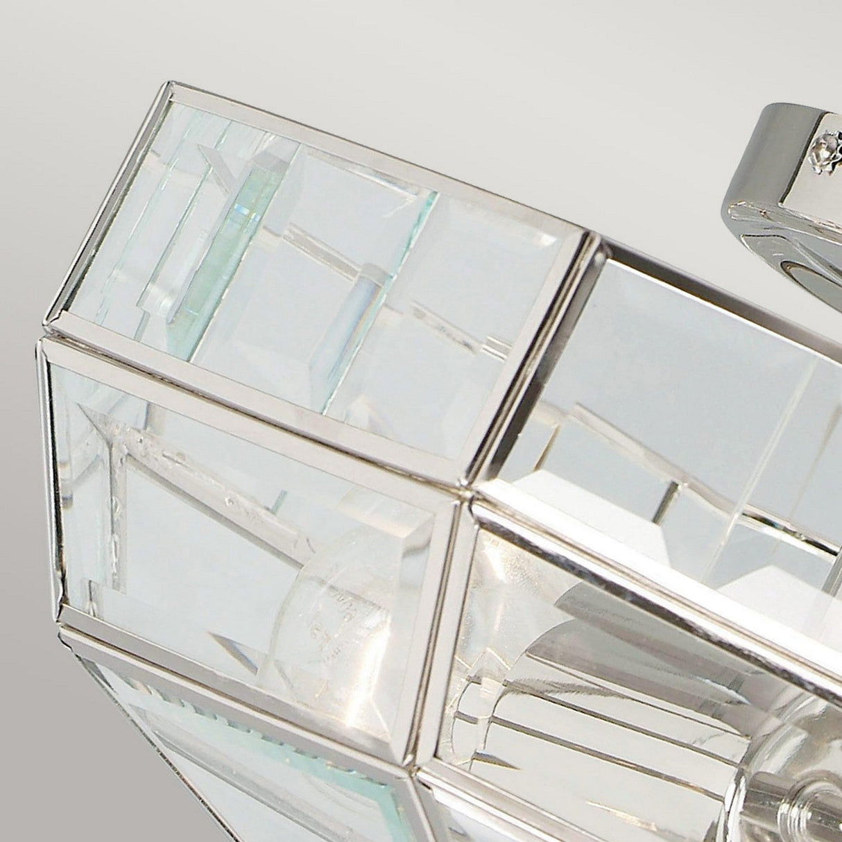 Close-up of the Old Park 2 Light Semi Flush in polished nickel, showcasing its modern geometric design with glass and sleek rectangular panels that beautifully reflect light for a contemporary look against a soft gray background.