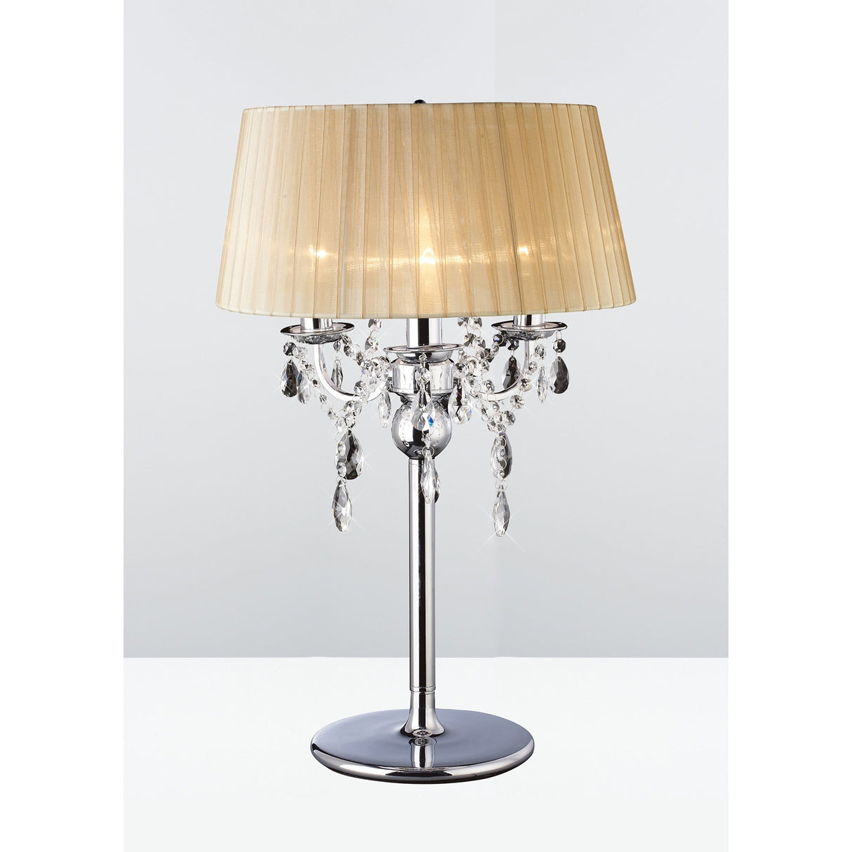 The Olivia 3 Light Crystal Table Lamp features a polished chrome base, decorative hanging crystals, and a bronze pleated shade, displayed against a simple white and light gray background.