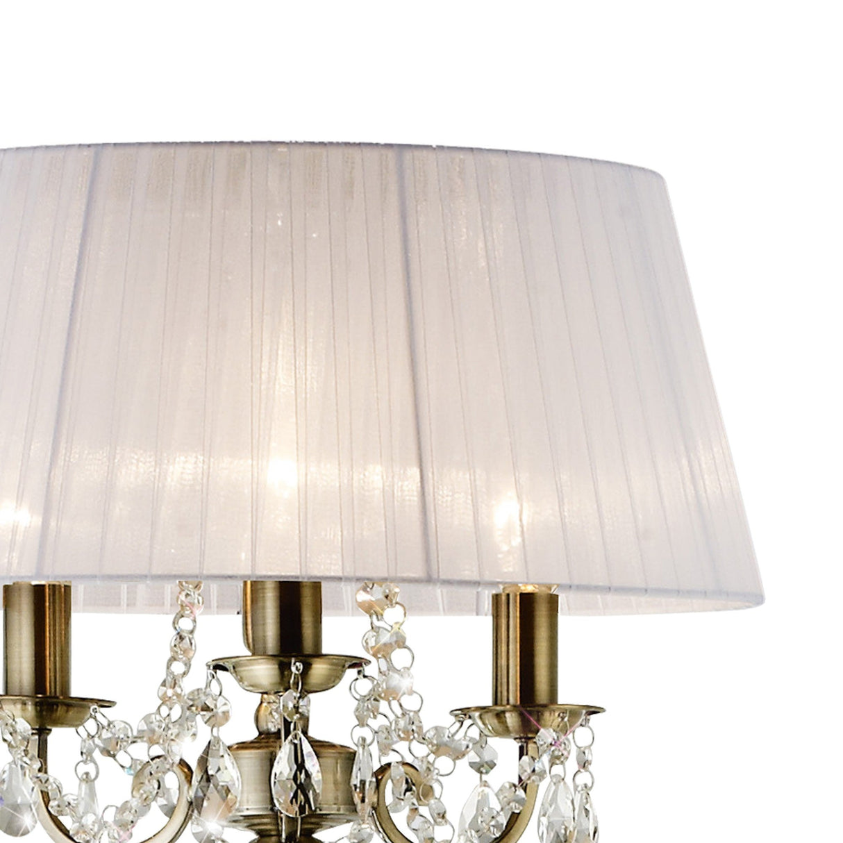 The Olivia 3 Light Crystal Floor Lamp features a brass finish, crystal accents, candle-style bulbs, and is topped with a large pleated white shade for classic elegance.