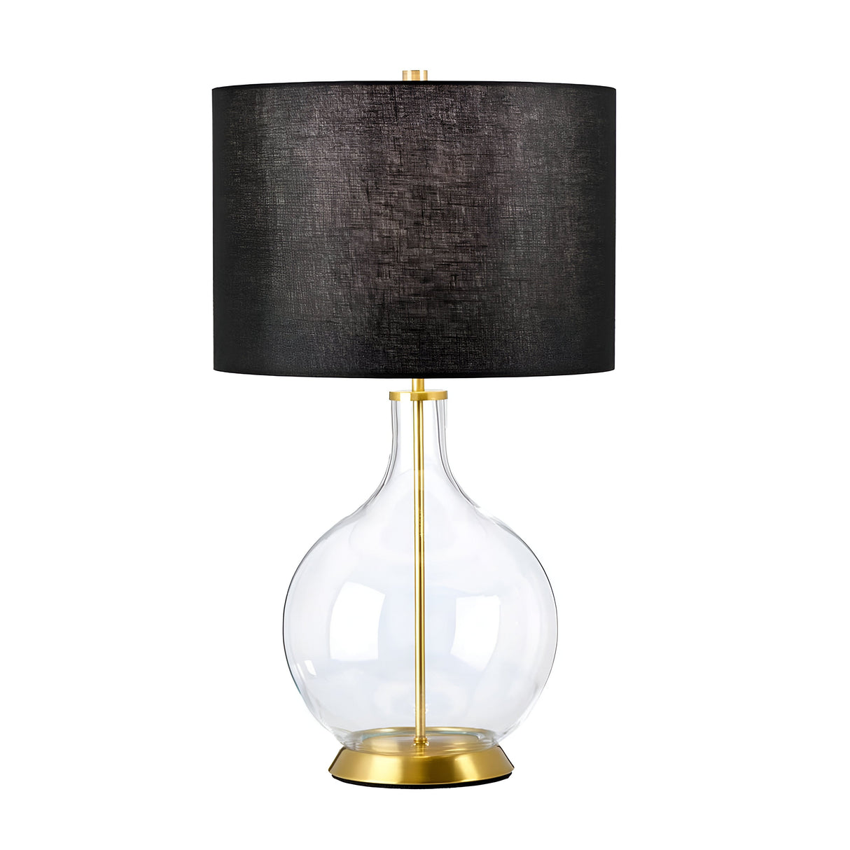 The Orb 1 Light Table Lamp - Aged Brass With Black Shade showcases a transparent, round glass base embellished with aged brass. It is elegantly finished with a large, cylindrical black shade, offering a modern design that effortlessly combines simplicity and luxury.