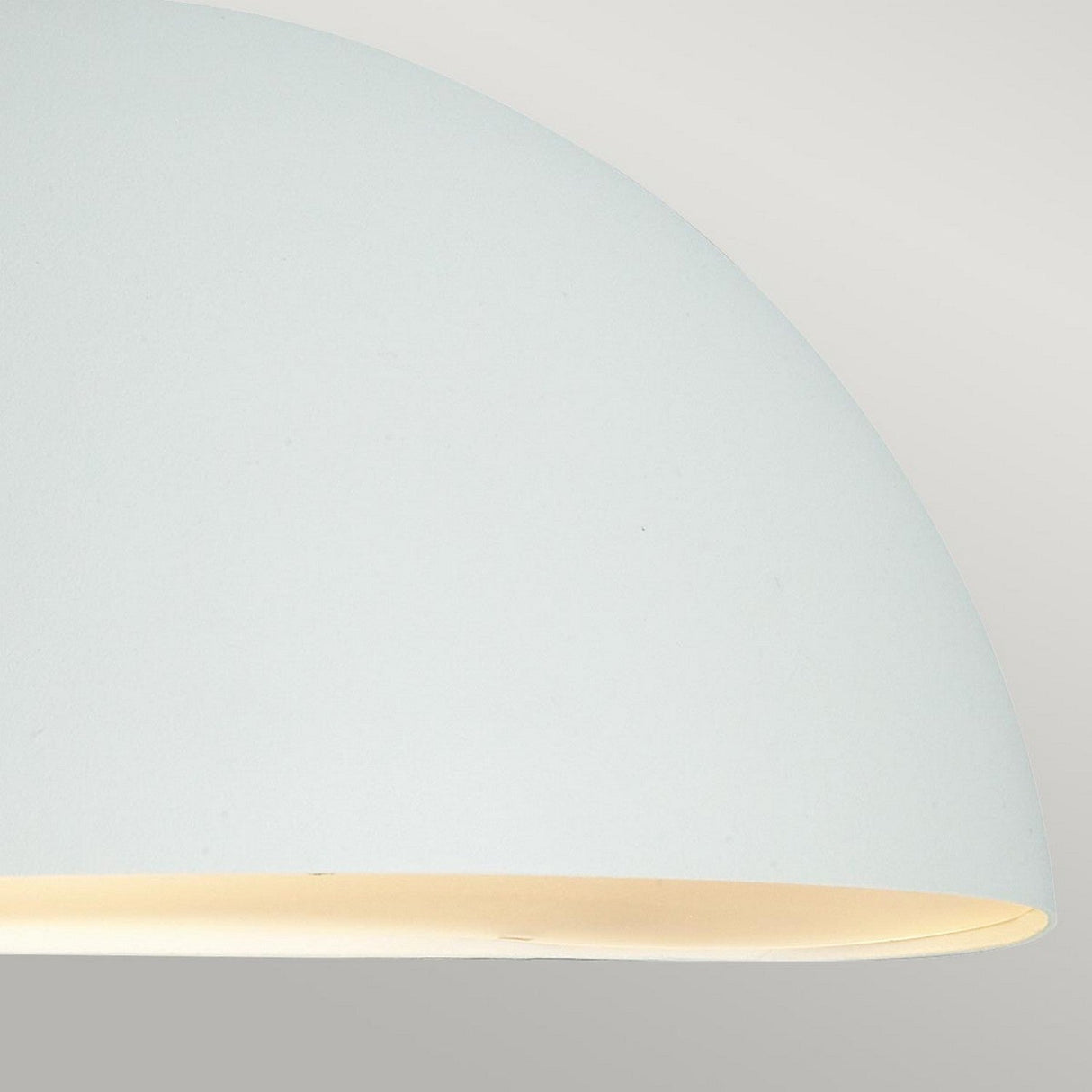 Close-up of the Paris Outdoor Large 1 Light Wall Lantern in white, featuring a minimalist dome shape with a smooth surface. The softly glowing light produces a subtle gradient against a light gray background, epitomizing modern outdoor lighting elegance.