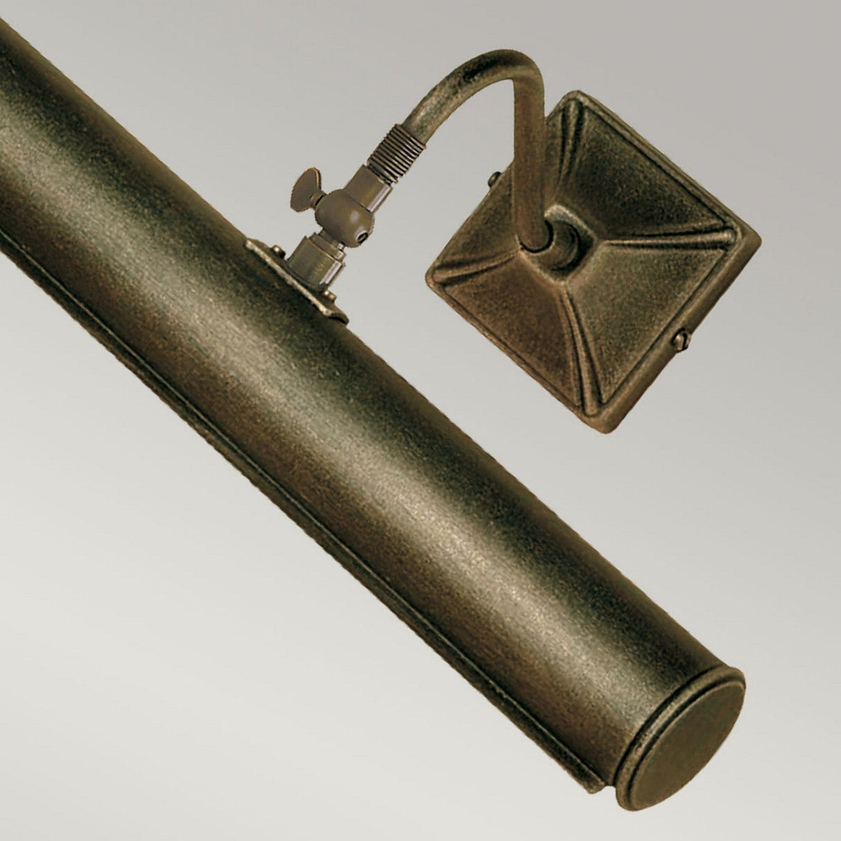 The Picture Light 2 Light Large - Black/Gold showcases a sleek cylindrical design with a square wall mount, available in sophisticated black/gold finishes. Its adjustable arm, highlighted by decorative screw details, provides versatility while elegantly enhancing a soft light gray background.