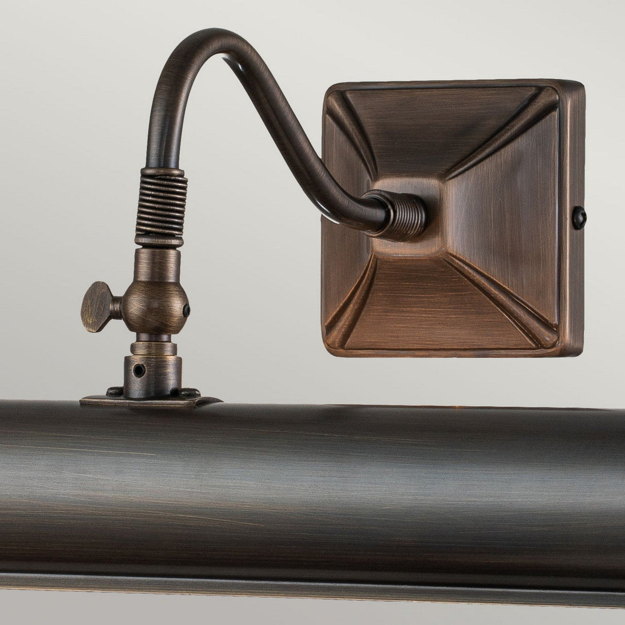 Dark bronze wall-mounted picture light fixture with a classic, antique finish features a curved arm and rectangular backplate. The Picture Light 2 Light Large - Dark Bronze offers adjustable lights for perfect versatility to enhance your artwork or photos.