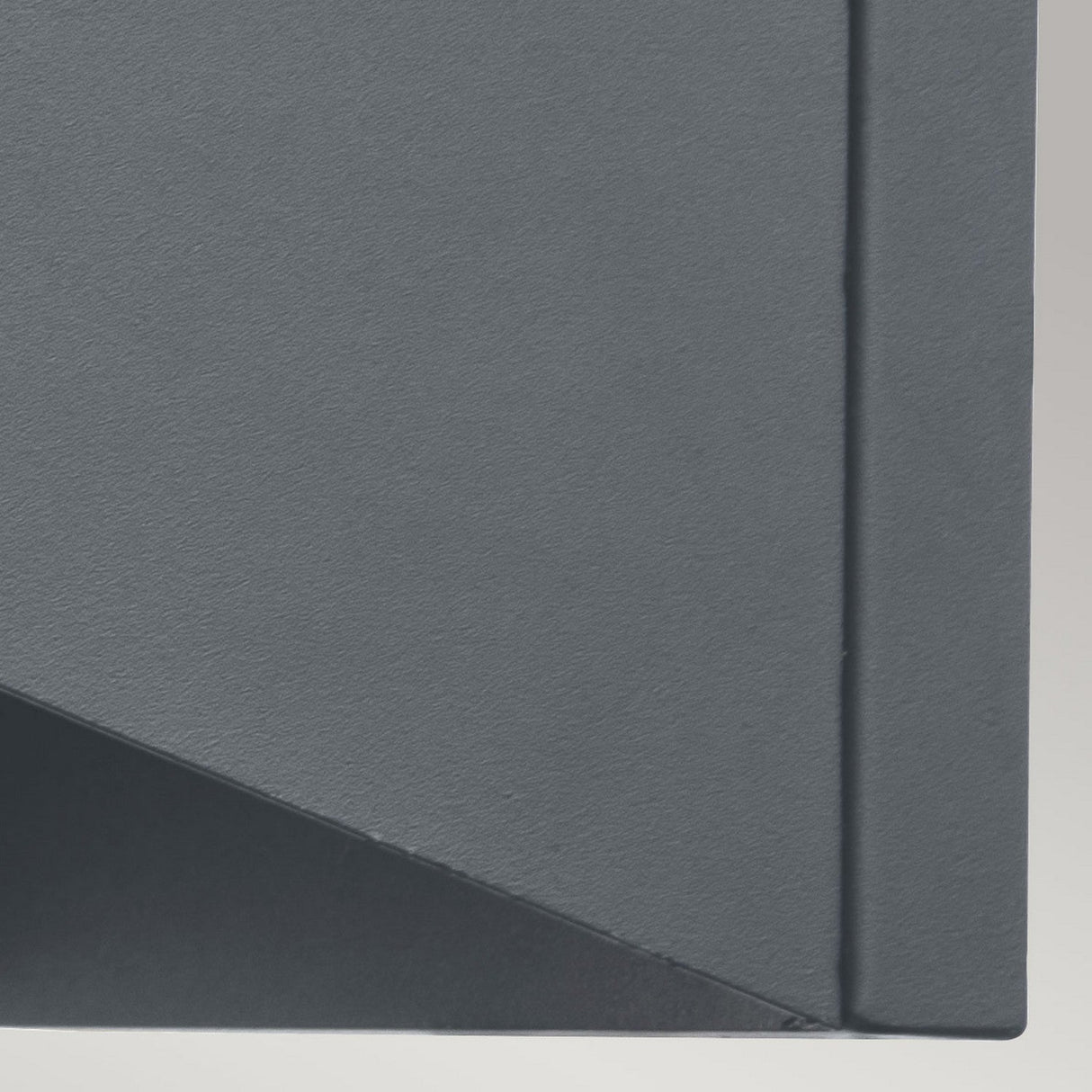 Abstract image showcasing geometric shapes in shades of dark grey and light grey. This composition prominently features a triangular shape, enclosed within a rectangular border, capturing the sleek elegance of stainless steel. The design subtly mirrors the nautical lantern elements found in the Porto 1 Light Outdoor Wall Light - Grey.