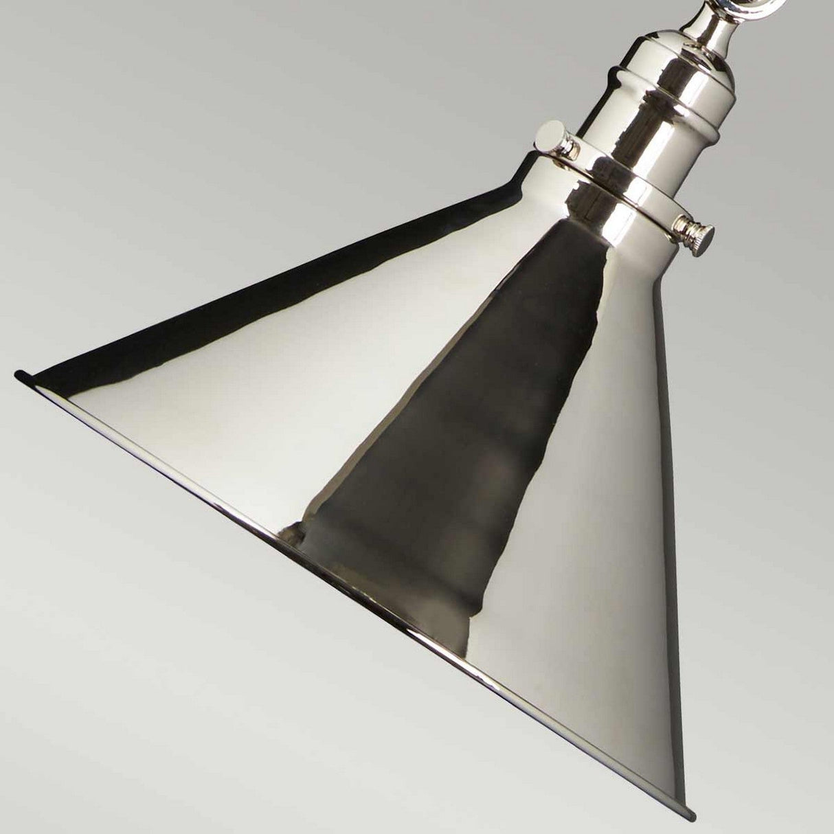The Provence 1 Light Wall Light/Pendant in polished nickel features a conical shape that hangs gracefully against a plain background. Its shiny, reflective finish accentuates its sleek, modern design, ensuring it adds an elegant touch to any room.