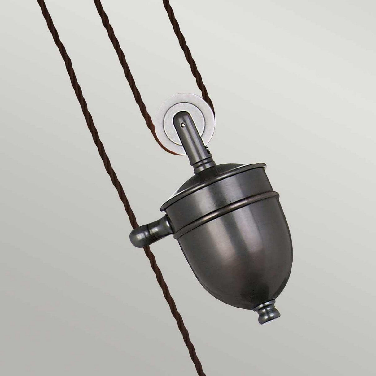 Product Description: The Provence 1 Light Rise & Fall Pendant in Old Bronze epitomizes classic French design with its vintage-style aesthetic. It features a rounded, industrial look, suspended by dark twisted cords, making it stand gracefully against a neutral background.