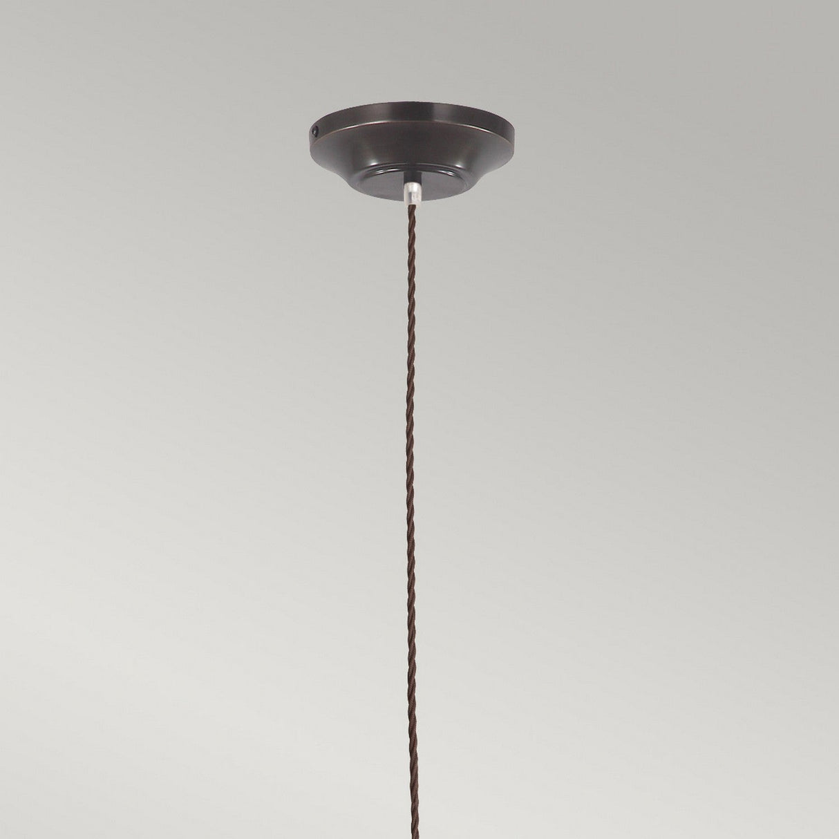 The Provence 1 Light Pendant - Old Bronze, featuring a dark brown finish and braided cord, exudes vintage charm as it is suspended from a round ceiling mount against a plain gray background.