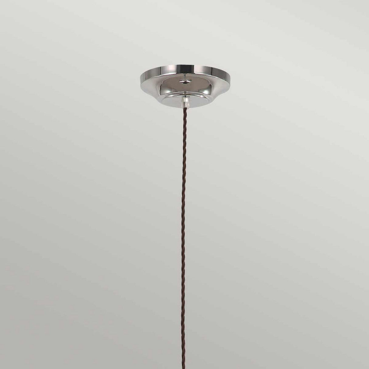 The Provence 1 Light Pendant in polished nickel features a vintage-inspired design with a metallic base and an elegant twisted brown cord. Its timeless charm is accentuated against a plain, light-colored background.