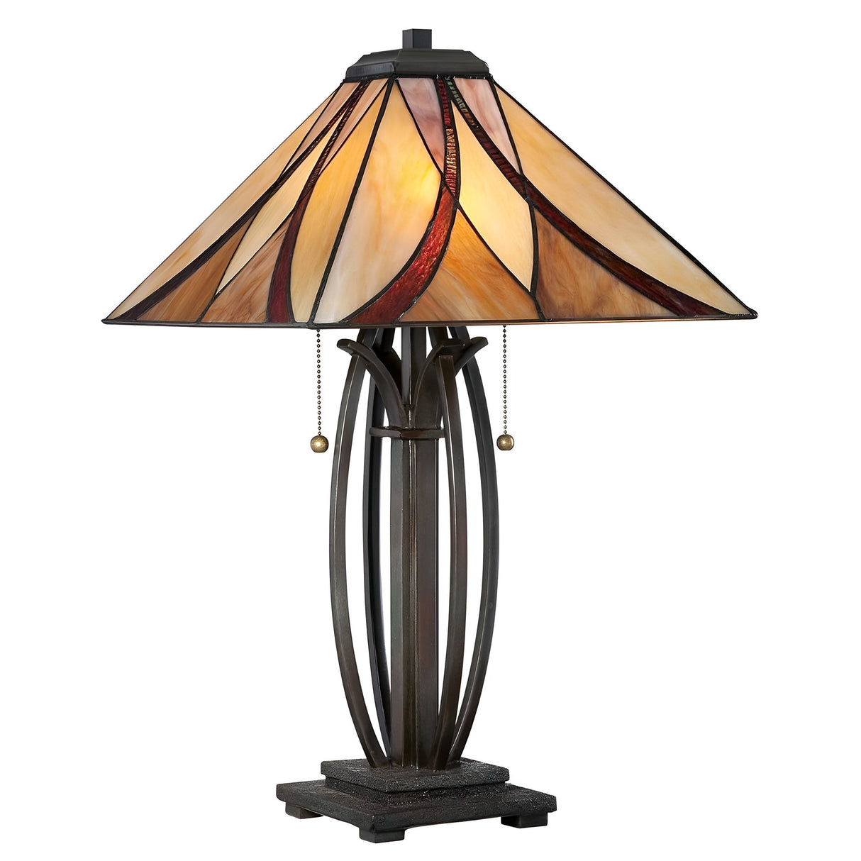 The Asheville 2 Light Tiffany Table Lamp - Valiant Bronze features a stained glass shade in a classic Tiffany-style with an abstract pattern of beige, amber, and red. The lamp is supported by an iron frame, operates with two pull chains, and sits on a dark, sturdy rectangular base finished in valiant bronze.
