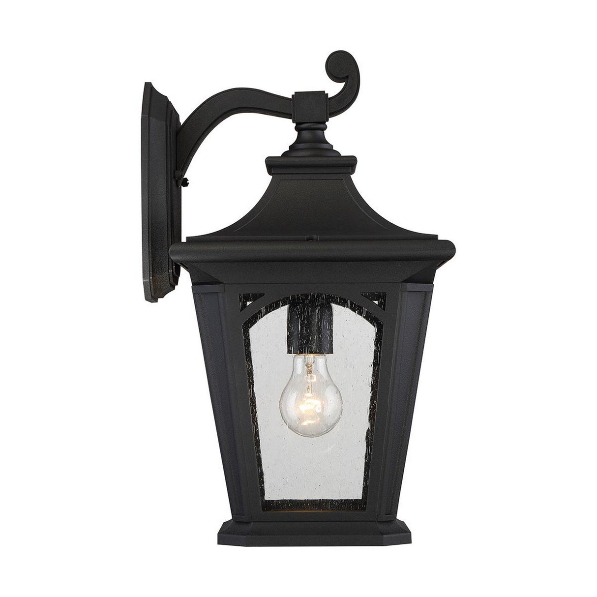 The Bedford Outdoor 1 Light Large Wall Lantern - Black showcases a traditional design with a curved arm and clear glass enclosure, revealing a single exposed bulb. Mounted on a flat rectangular base, it offers weather-resistant lighting suitable for any setting.