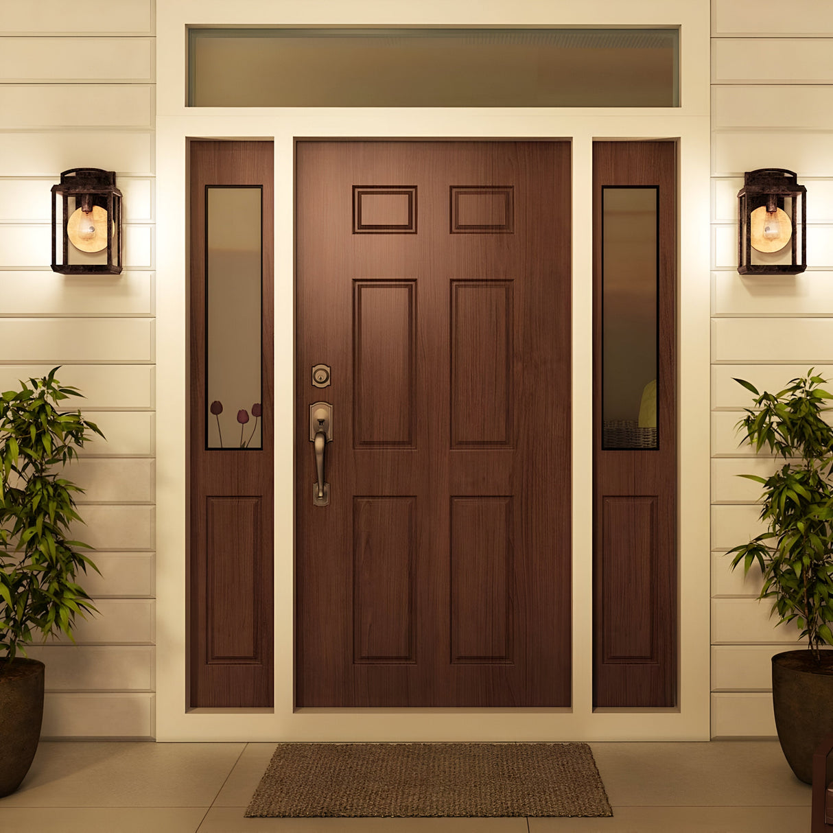 A wooden front door with rectangular panels is flanked by narrow glass sidelights. Two Byron Outdoor 1 Light Medium Wall Lanterns in Imperial Bronze with Copper Reflectors illuminate the entrance. Potted plants are placed on each side, and a welcome mat lies in front of the door.