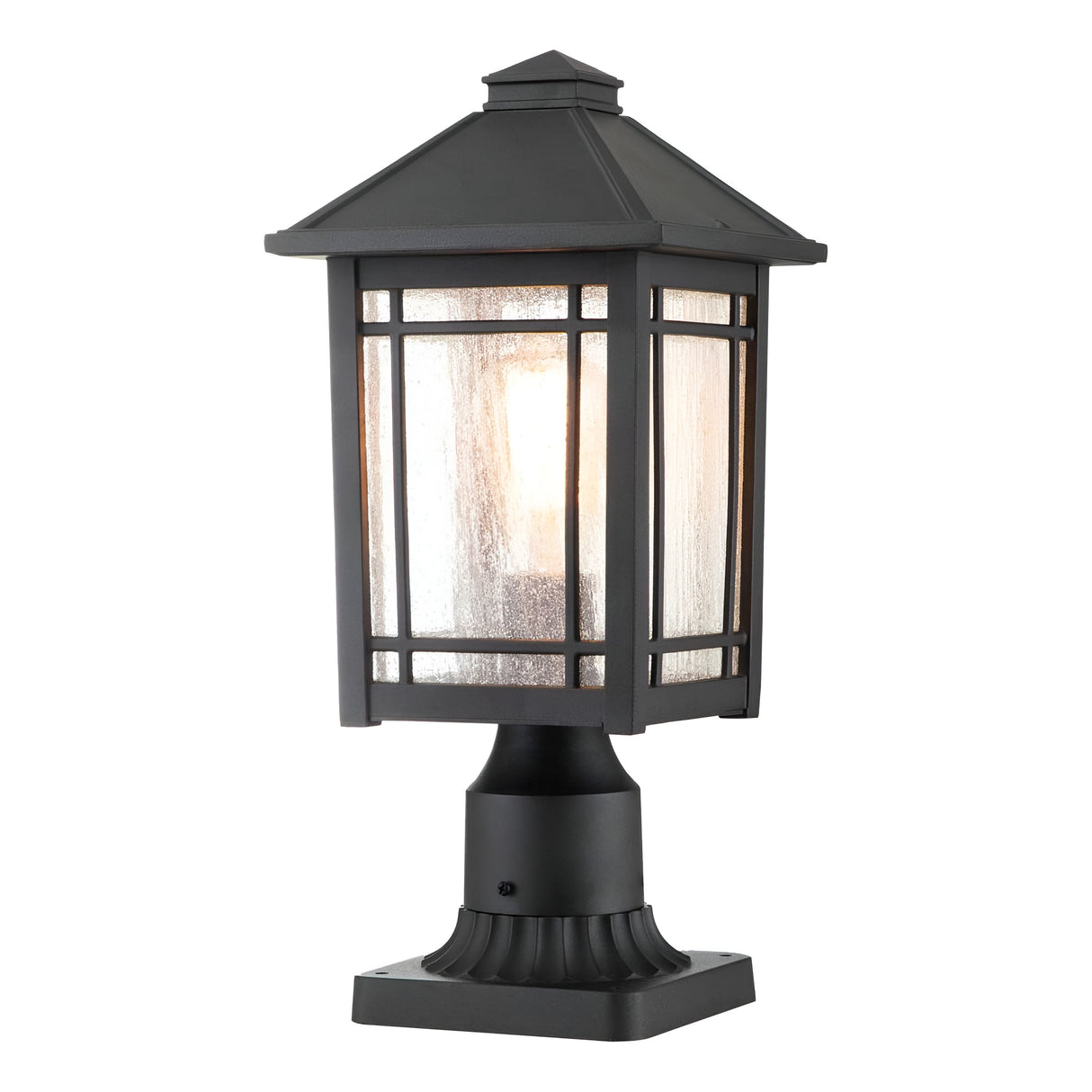 The Cedar Point 1 Light Pedestal in black showcases a vintage charm with its square design and frosted glass enclosure. It includes a decorative top and ribbed base, housing a single visible bulb that provides a soft glow, ideal for lighting up your outdoor pathways.