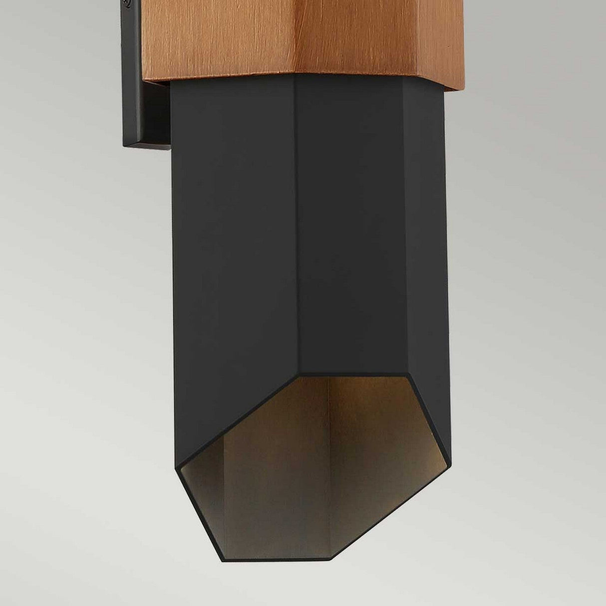 The Chasm Outdoor LED Large Wall Lantern in Matte Black is presented against a neutral background. This lantern combines integrated LED technology with a sleek, geometric design that adds an elegant ambiance to any space.