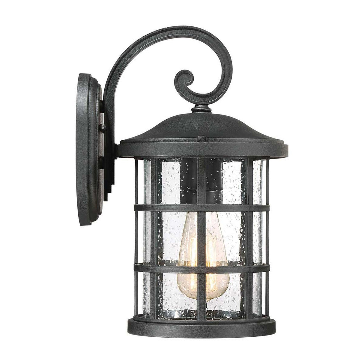 The Crusade Outdoor 1 Light Medium Wall Lantern in black boasts a dark metal frame with clear glass panels, featuring an Edison-style bulb and decorative scroll detail on top for a rustic look. Its textured glass adds a touch of elegance, while the IP44 rating ensures it is durable enough to withstand outdoor elements.