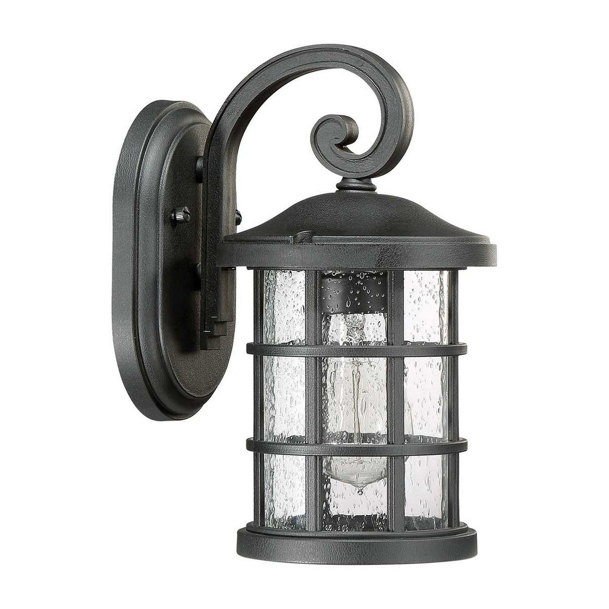 The Crusade Outdoor 1 Light Small Wall Lantern in black features a decorative scroll arm and clear seeded glass panels. This craftsman-style design includes a cage-like structure surrounding the bulb, mounted on an oval backplate, enhancing the elegance of any exterior space.
