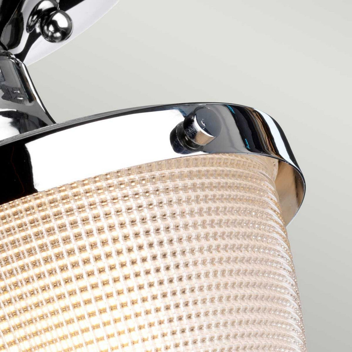 Close-up of the Dublin 1 Light Semi Flush in polished chrome, featuring a textured glass shade, set against a pale background.