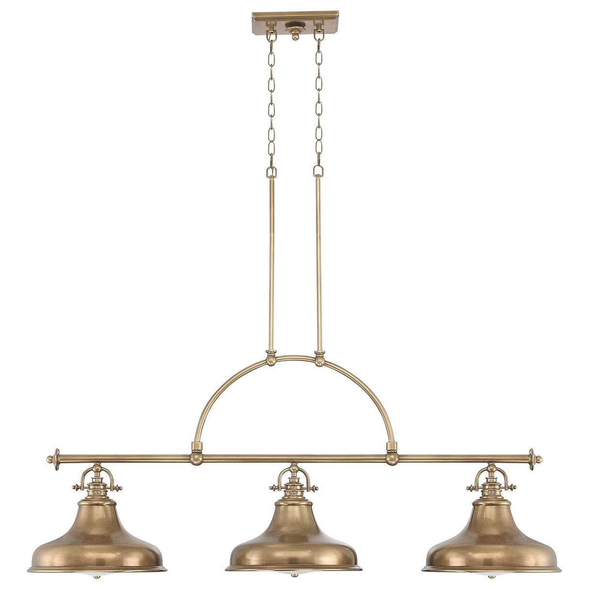 The Emery 3 Light Island Pendant in Weathered Brass, boasting an industrial-style design with three round lampshades, hangs gracefully from the ceiling. Supported by a metal rod and chain, this fixture exudes elegant charm through its vintage-inspired aesthetic.