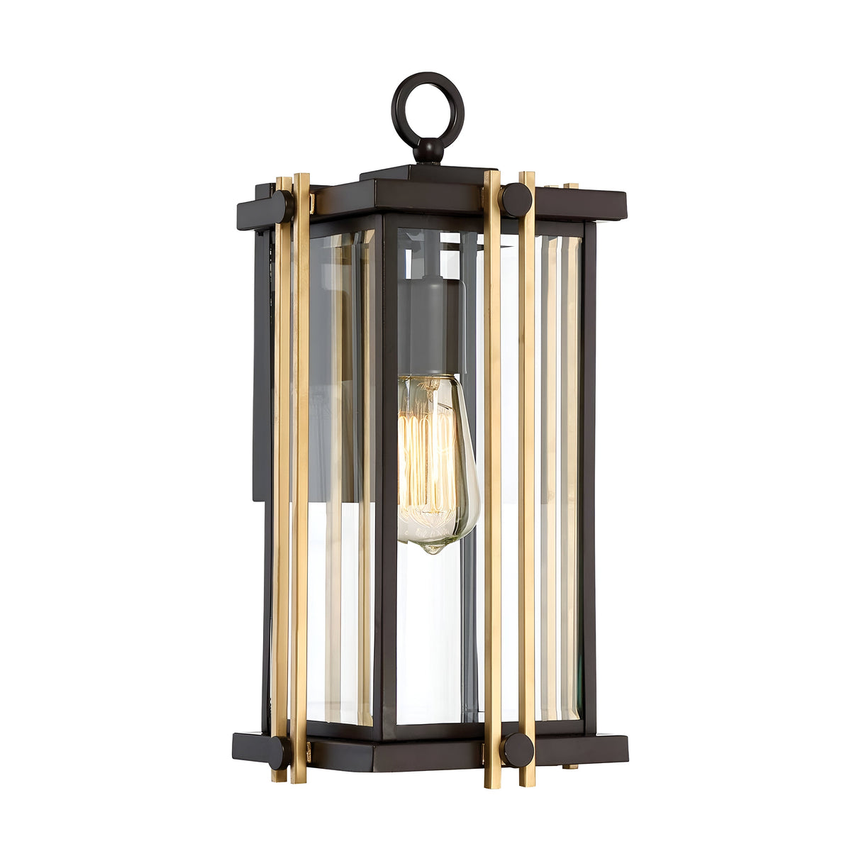 The Goldenrod Outdoor 1 Light Medium Wall Lantern - Bronze evokes Mid-Century lighting with its black and gold frame and clear glass panels. A filament bulb shines within, surrounded by four vertical gold accents. The fixture, resembling a Western bronze lantern, hangs gracefully from a small loop at the top.