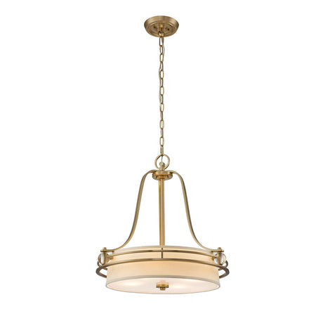 A small chandelier in brushed brass, featuring a circular cream shade and suspended by a chain, showcases sleek curves and minimalistic details that embody the elegance of the Gotham 4 Light Chandelier for a modern, stylish look.