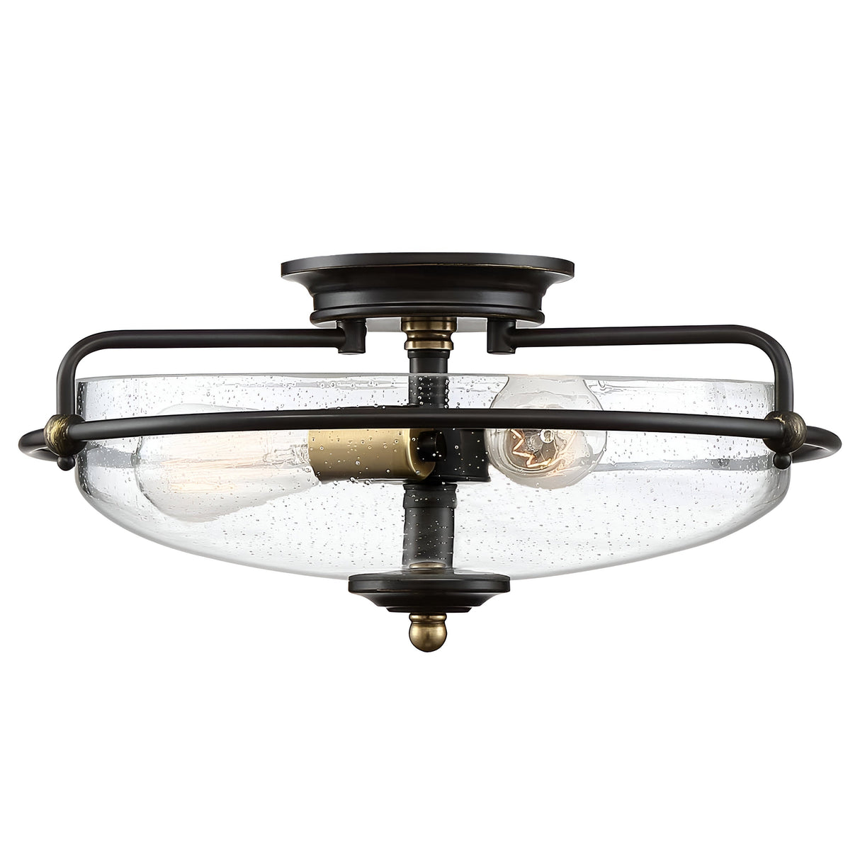 The Griffin 3 Light Flush in Palladian Bronze with Weathered Brass Accent is a semi-flush mount ceiling light fixture featuring a clear, rounded glass shade and a vintage-style bulb encased in a dark metal frame. Its design showcases an industrial and modern aesthetic.