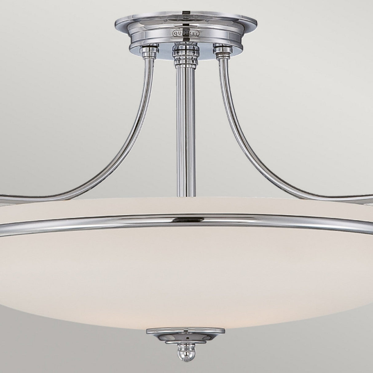 The Griffin 3 Light Semi-Flush - Polished Chrome showcases a modern design with sleek metal arms radiating from its base and a frosted white glass shade, all set against a light gray background.