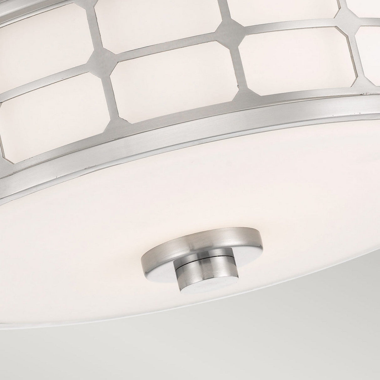 Close-up of the Guardian 2 Light Flush, featuring a modern design with an opal glass shade and a metallic geometric pattern. The brushed nickel finish is enhanced by a central metallic knob for its attachment.