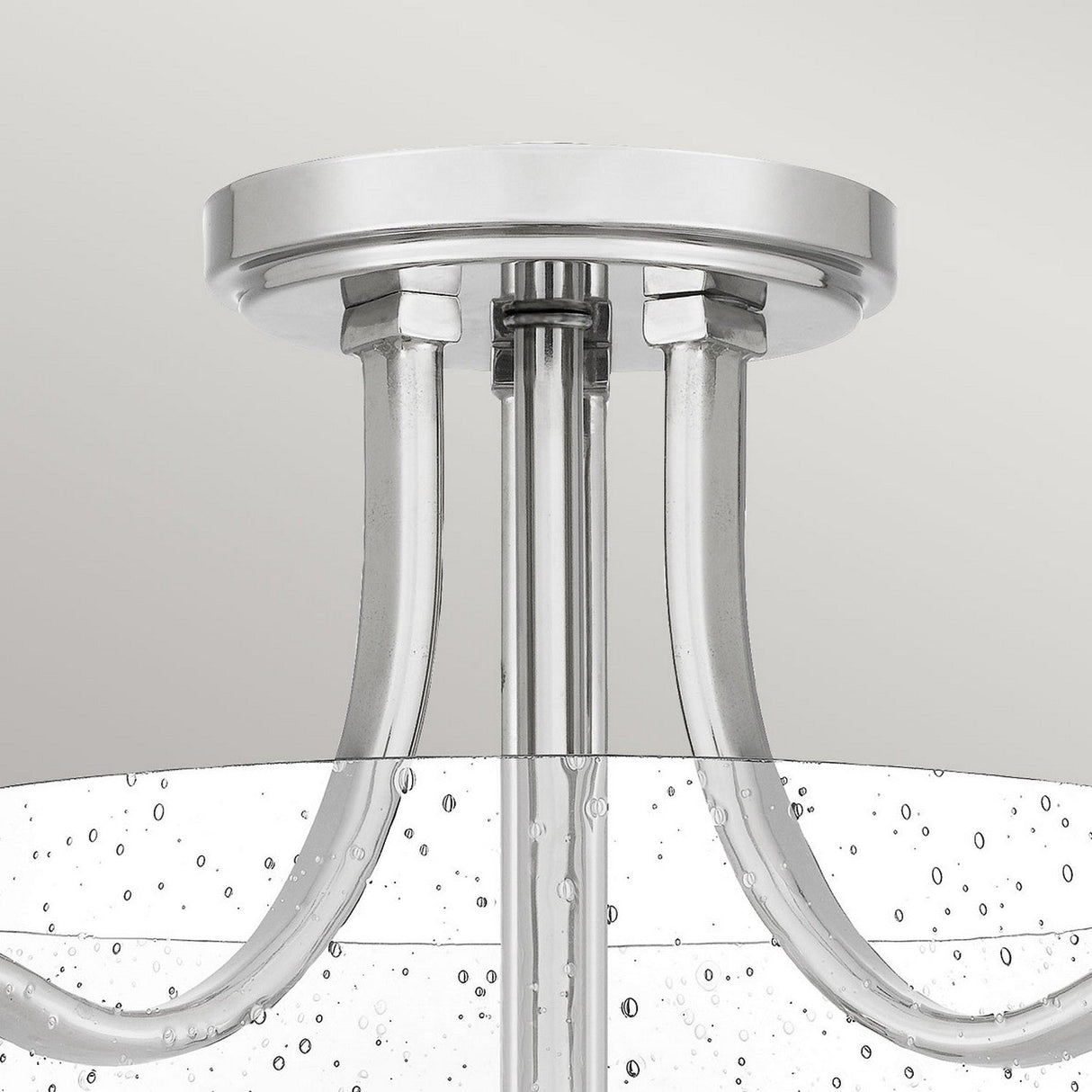 Close-up of the Hollister 2 Light Semi-Flush chandelier in polished nickel, featuring a circular chrome base and glass arms with water droplet textures. This fixture showcases an elegant and contemporary look against a neutral background.