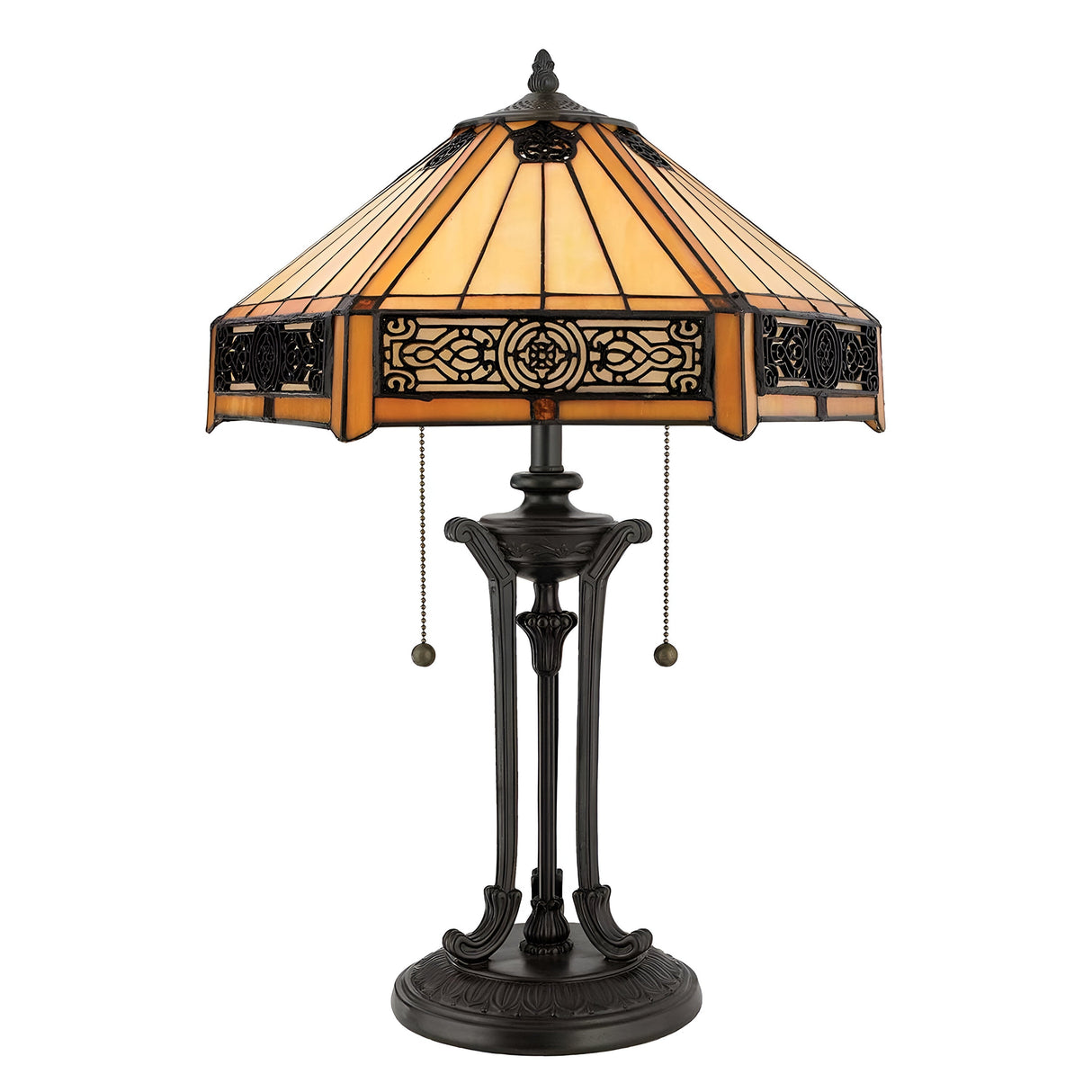 The Indus 2 Light Tiffany Table Lamp in Vintage Bronze radiates vintage charm with its amber glass shade. The intricately designed base, finished in vintage bronze and equipped with pull chains for easy operation, beautifully complements the warm tones of the ornate stained glass.
