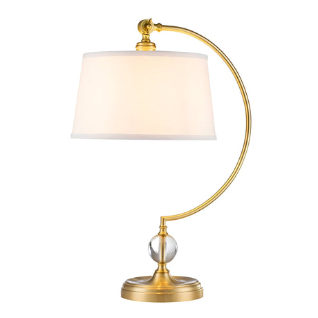The Jenkins 1 Light Table Lamp - Brushed Brass showcases modern elegance with its curved brass stand and white fabric shade. The brushed brass stand includes a decorative glass orb at the base, enhancing its elegant appeal.
