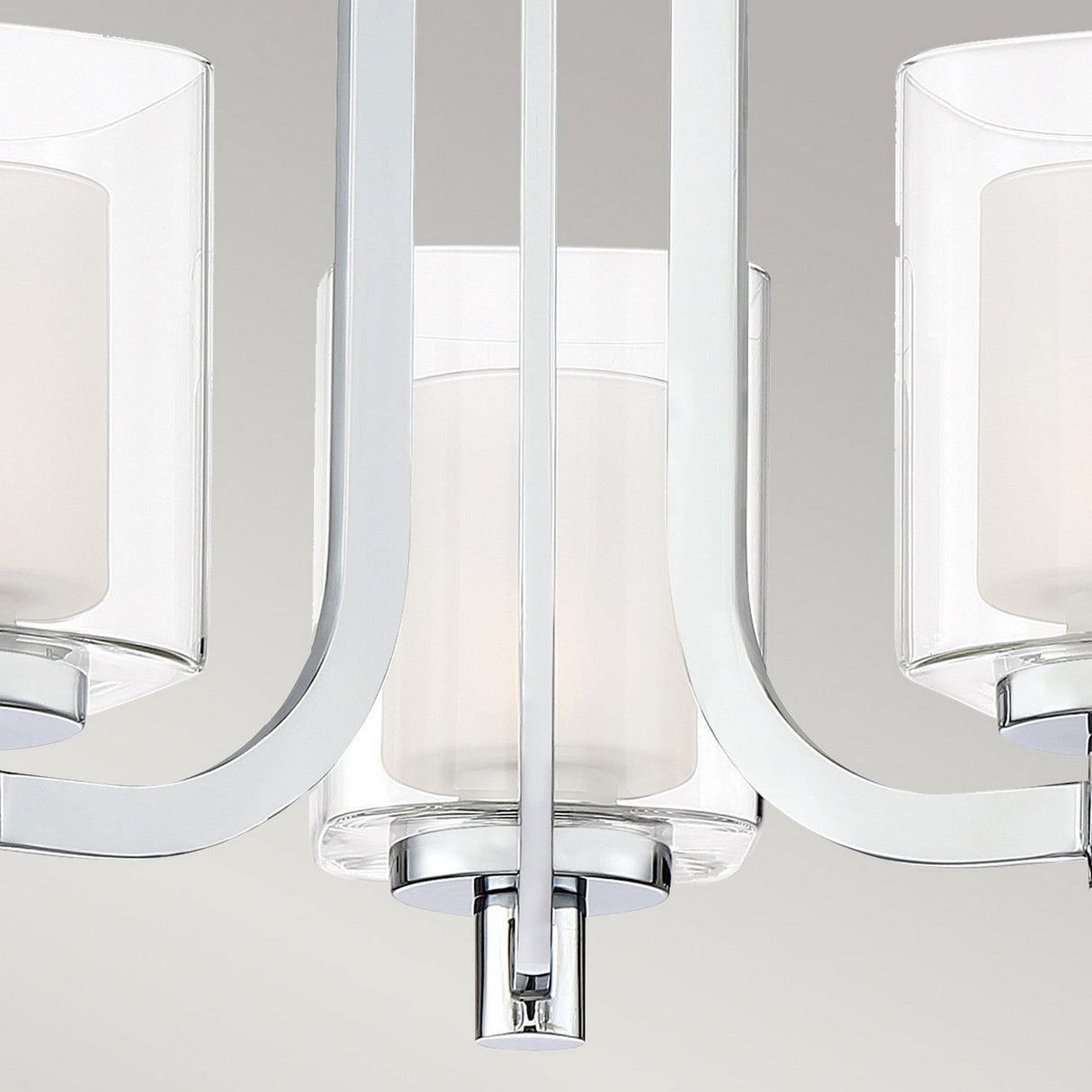 Close-up of the Kolt 3 Light Wall Light in polished chrome, featuring three dual-glass frosted shades. The sleek metal frame and minimalist design provide a contemporary appearance against a neutral background, making it ideal for stylish bathroom lighting.