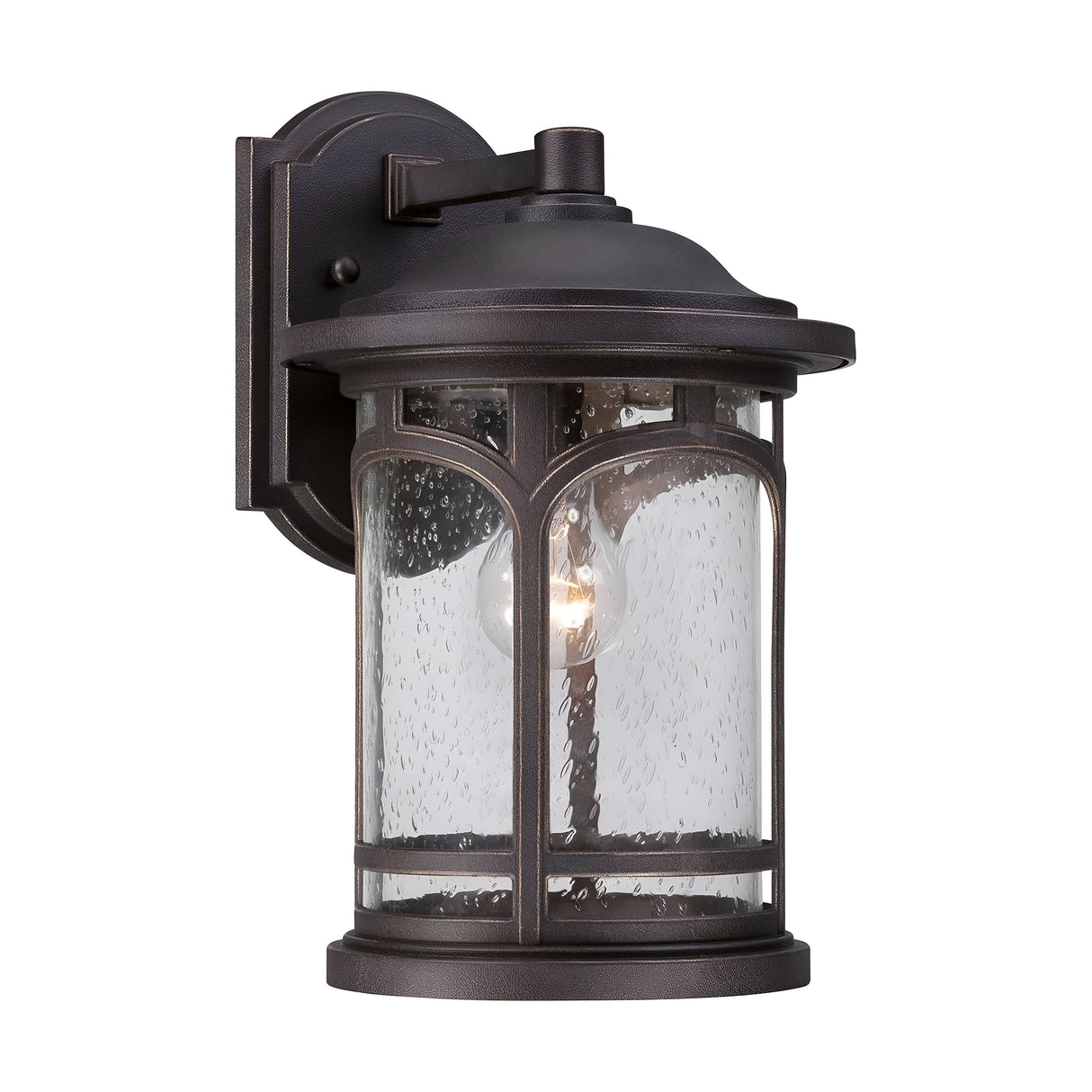 The Marblehead Outdoor 1 Light Medium Wall Lantern, designed in Palladian Bronze, showcases a vintage style with a weather-resistant metal frame and a cylindrical glass shade adorned with a raindrop pattern. Its slightly weathered finish enhances its charm while the interior bulb casts a warm glow.