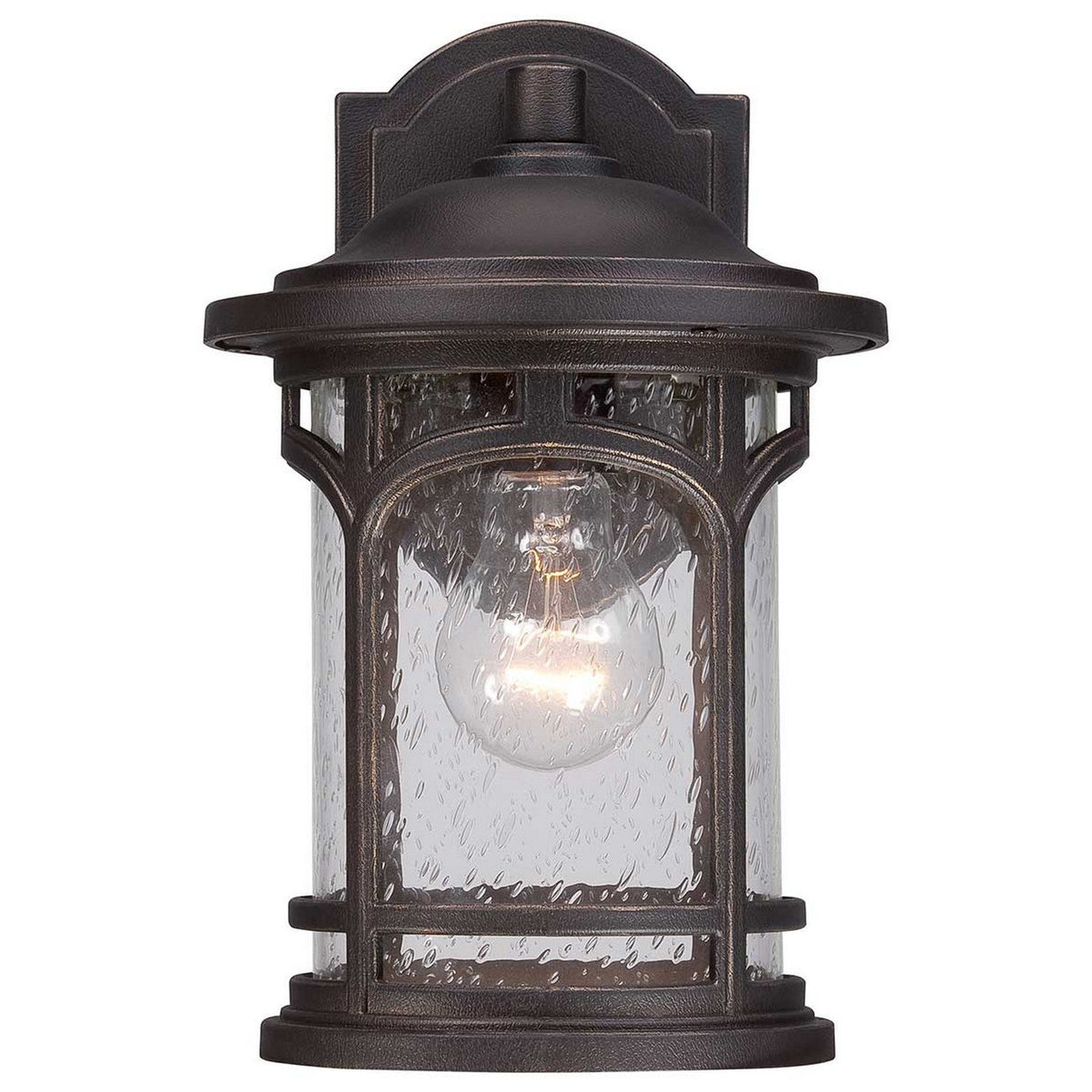 The Marblehead Outdoor 1 Light Small Wall Lantern in Palladian Bronze features a vintage-style design with a black metal frame and seedy glass panels. This lantern displays a single bulb through its textured glass, complemented by decorative elements on the top and bottom.