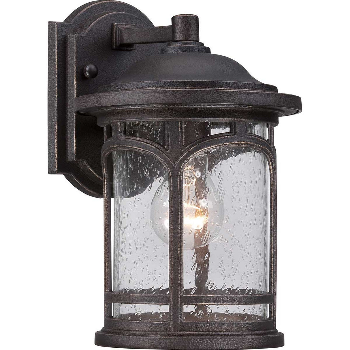 The Marblehead Outdoor 1 Light Small Wall Lantern in Palladian Bronze features seedy glass panels and a classic design with an arched top and visible light bulb, elegantly mounted on a rectangular base.