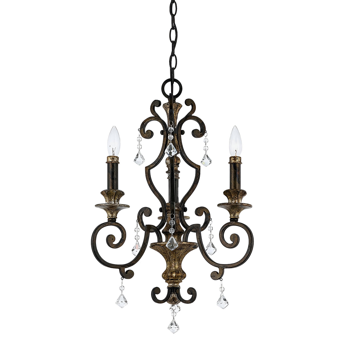 The Marquette 3 Light Chandelier in bronze features a vintage style with three candle-shaped bulbs. Its ornate metal design includes scroll details and crystal drops, adding an elegant touch. The fixture is suspended from a chain, enhancing its timeless charm.