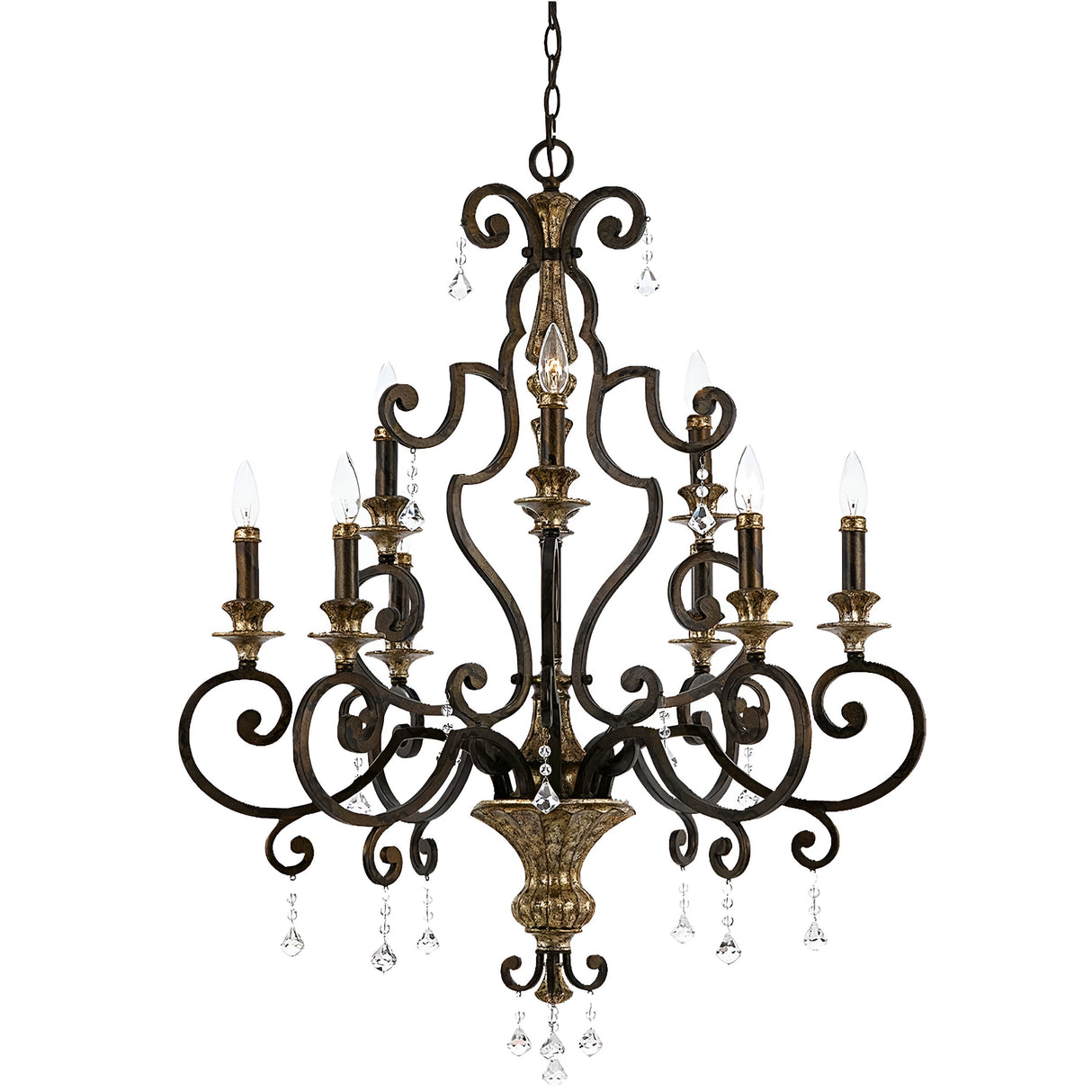 The Marquette 9 Light Chandelier in bronze boasts a dark metal frame embellished with intricate scrollwork and showcases six candle-style lights accompanied by hanging crystal drops, exuding an elegant charm.