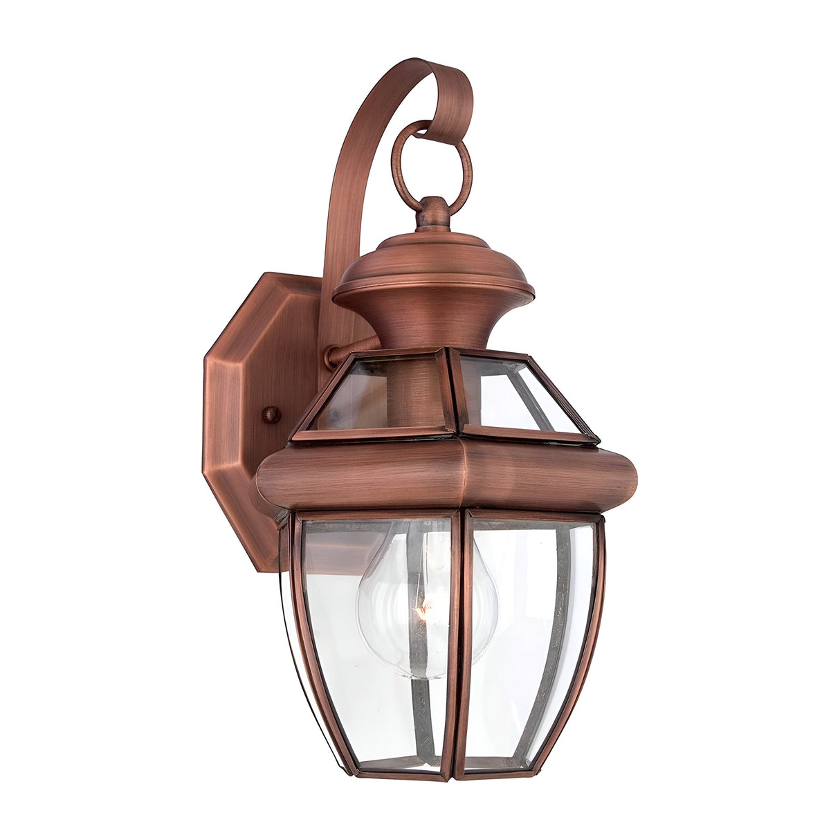 Introducing the Newbury Outdoor 1 Light Small Wall Lantern in Lacquered Aged Copper: This elegant outdoor wall fixture is designed with clear beveled glass in a hexagonal shape, showcasing a lacquered aged copper finish. It features a gracefully curved arm and loop on top, mounted on a rectangular backplate, encasing the bulb flawlessly within its stylish form.