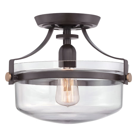 The Penn Station 1 Light Semi-Flush in Western Bronze features a modern design with a round glass shade and exposed filament bulb. It combines a black metal frame with Western Bronze accents and curved supports, while the brass detailing offers a sleek contemporary appearance with a subtle rustic touch.