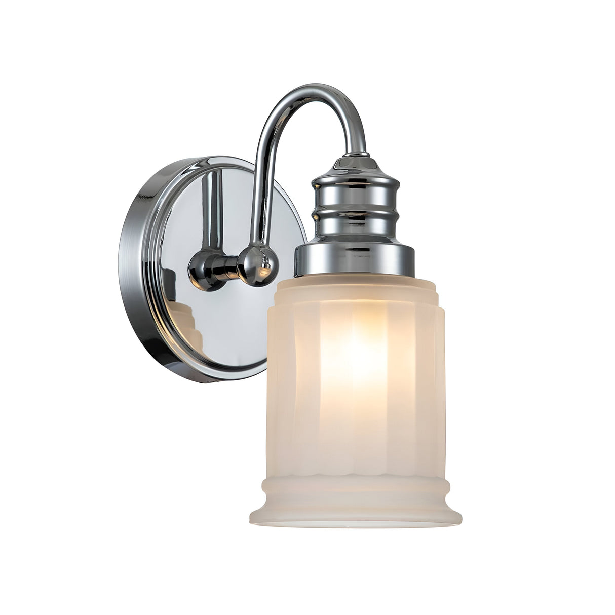 The Swell 1 Light Wall Light - Polished Chrome is a wall-mounted fixture perfect for bathrooms, featuring an IP44 rating. It has a frosted glass shade that emits a warm glow, and its design boasts a curved arm linking the base to the cylindrical shade with delicate vertical grooves.