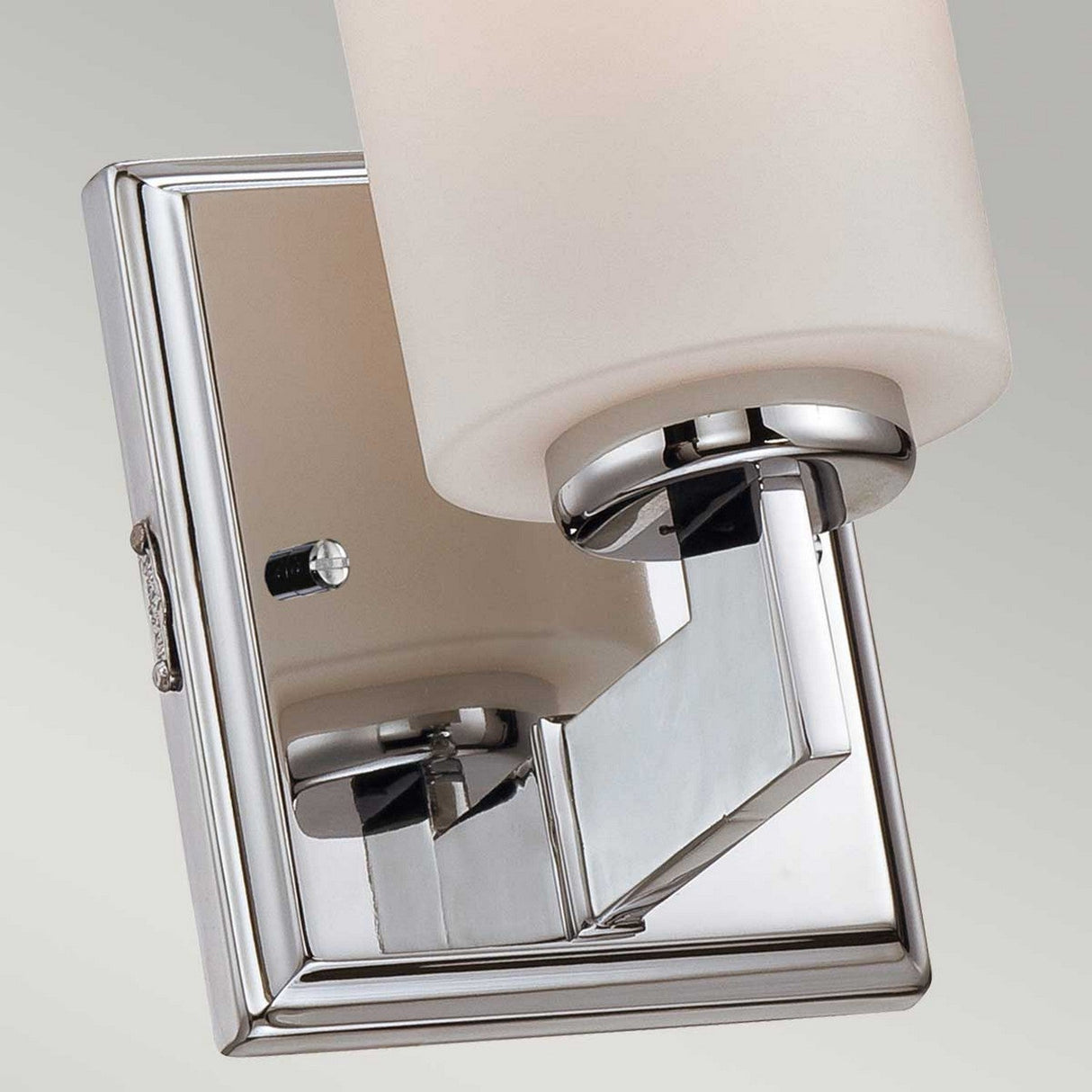 The Taylor 1 Light Small Wall Light in polished chrome boasts a contemporary design with a sleek, rectangular base and an opal glass shade, making it perfect for minimalist home decor.