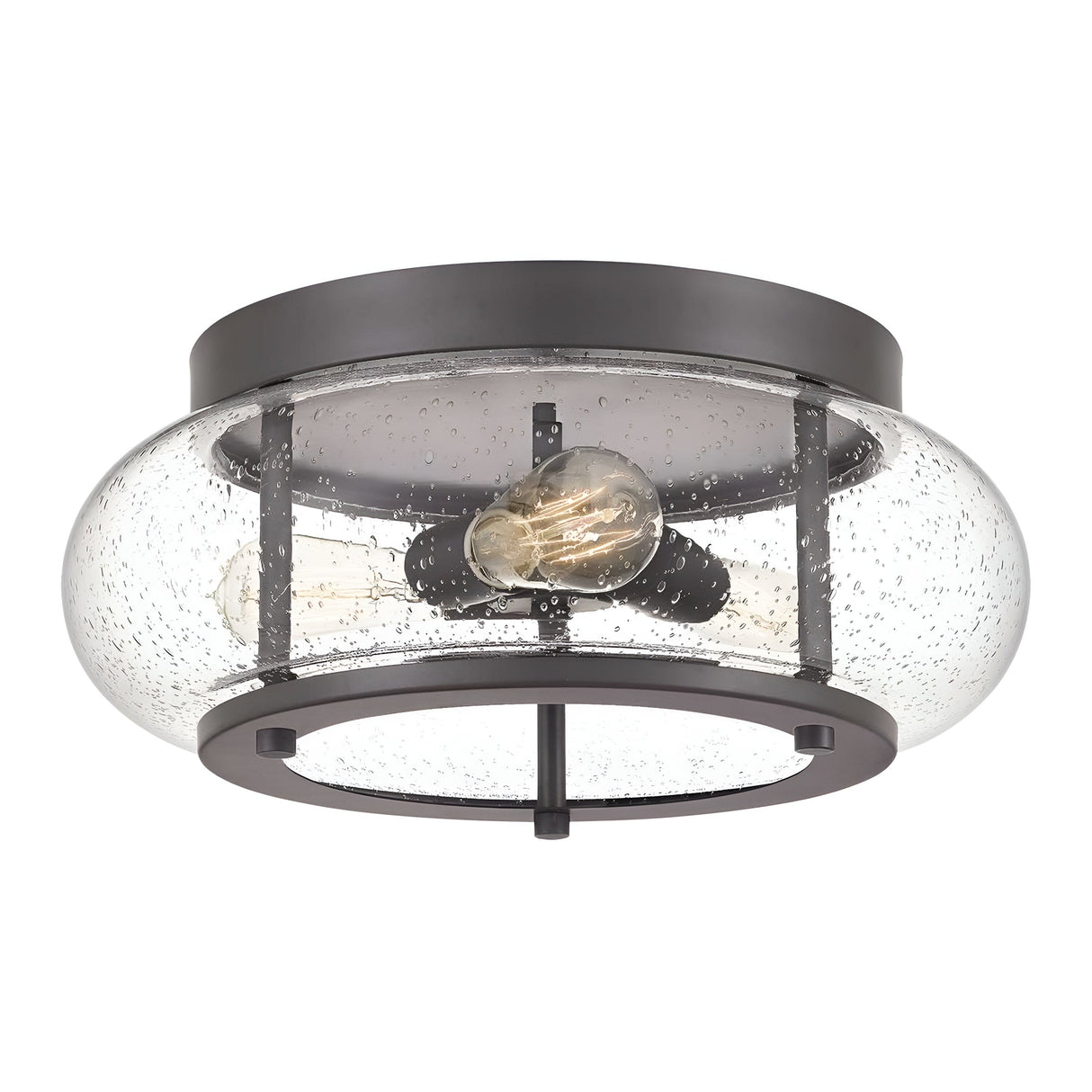 The Trilogy 3 Light Flush - Old Bronze is a round ceiling light with a black metal frame and a clear, seeded glass shade. It includes two Edison-style LED filament bulbs inside, which contribute to its industrial appearance.