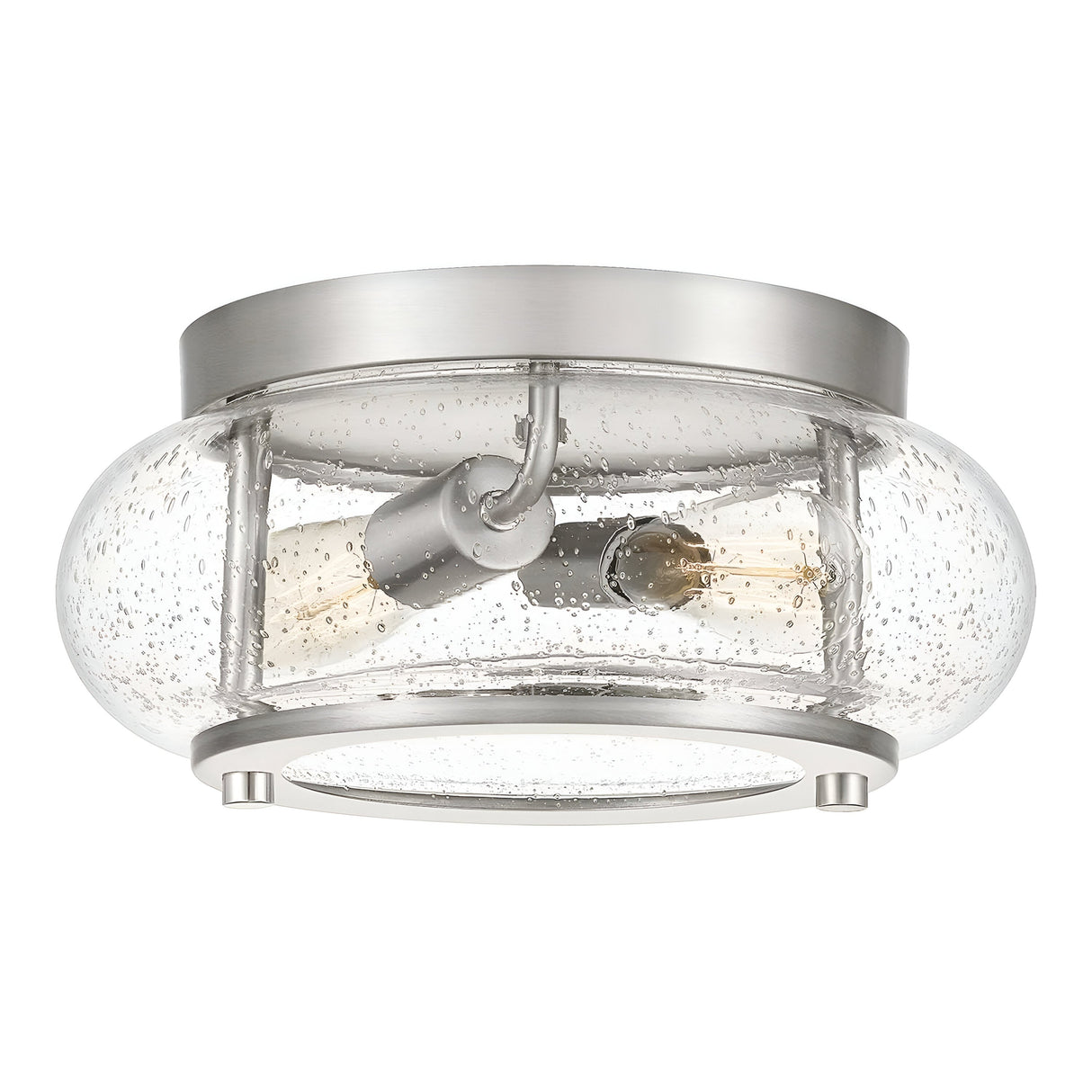 The Trilogy 2 Light Flush - Brushed Nickel features a contemporary brushed nickel finish combined with a circular clear seeded glass shade, highlighting two visible exposed bulbs that add an industrial flair to this chic design.