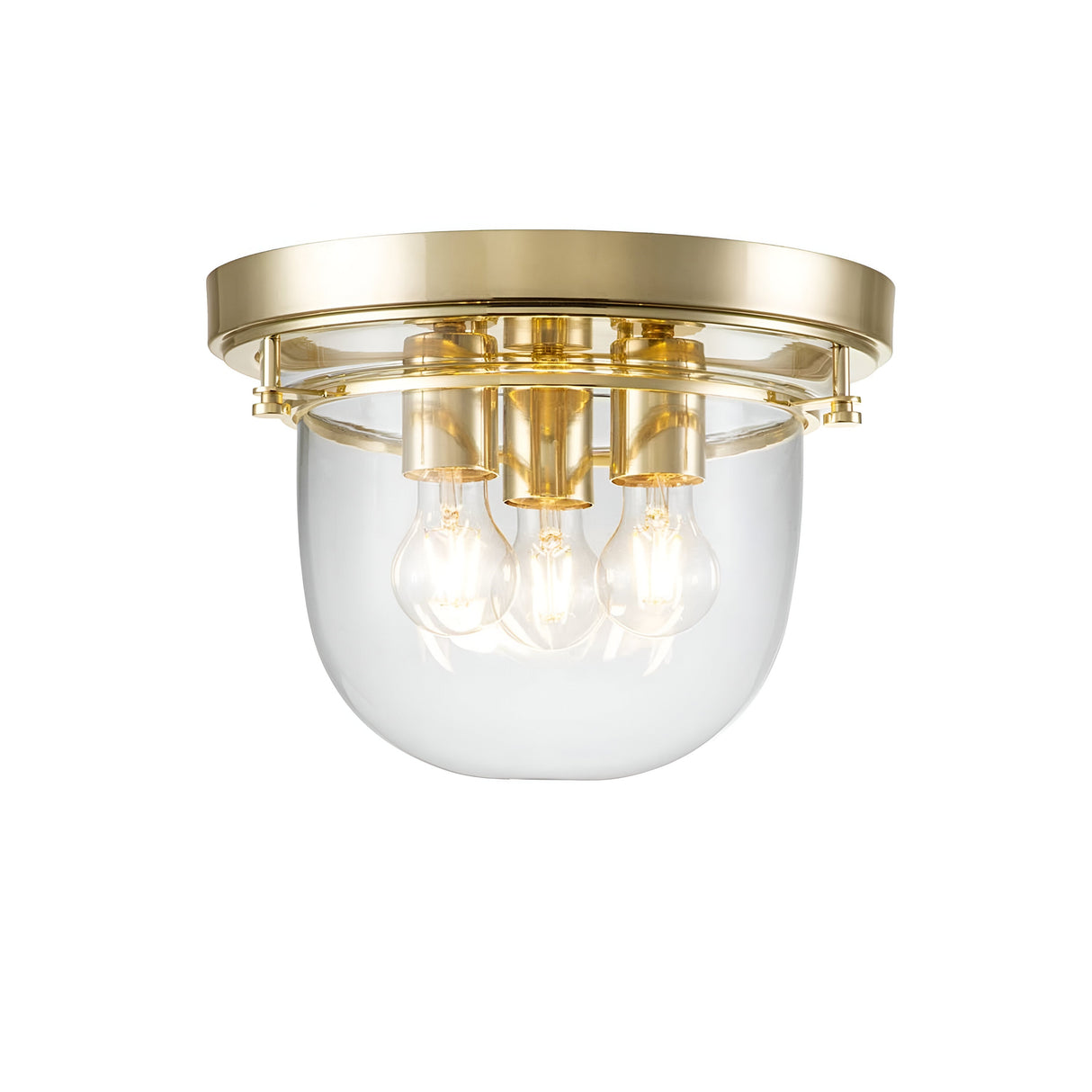 The Whistling 3 Light Flush - Polished Brass is a modern ceiling light fixture featuring a polished brass finish and a clear glass dome, ideal for bathroom lighting. It showcases three exposed bulbs, providing a sleek and contemporary look.