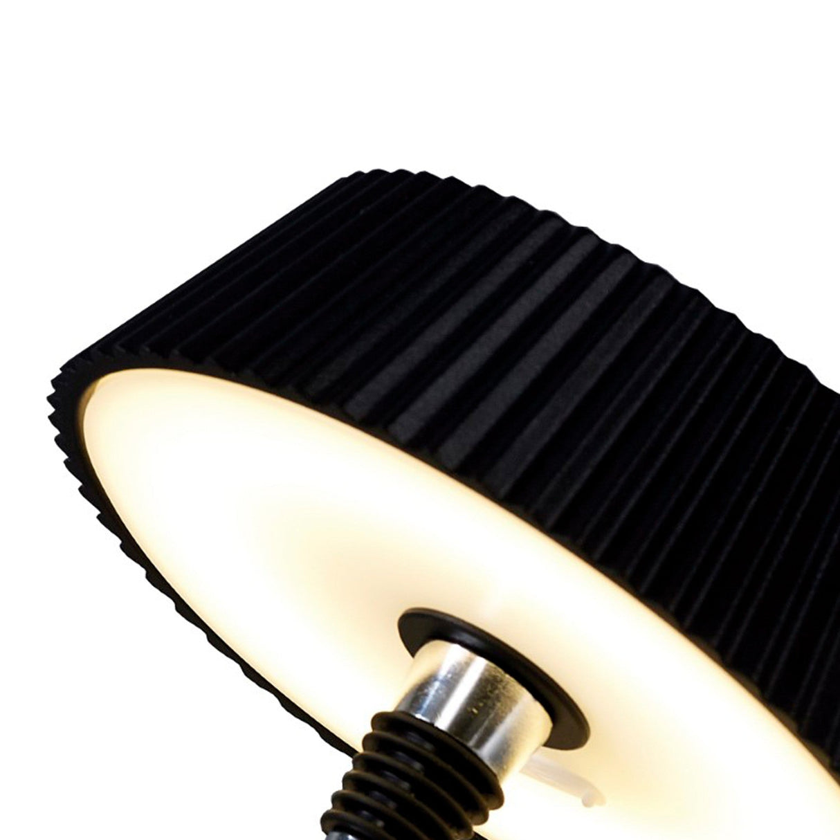 Close-up of the Relax Touch Dimmable LED Battery Bottle Outdoor Table Lamp in black, featuring a pleated shade and warm white glow, set against a white background.