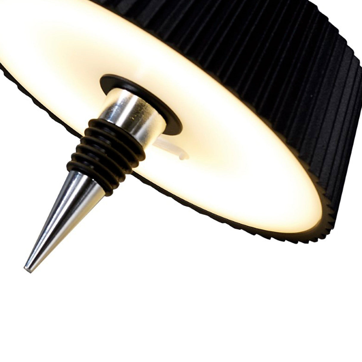 Close-up of the Relax Touch Dimmable LED Battery Bottle Outdoor Table Lamp in black, featuring a modern ribbed circular shade, illuminated rim, and sleek pointed metallic cone at the center for a contemporary look.